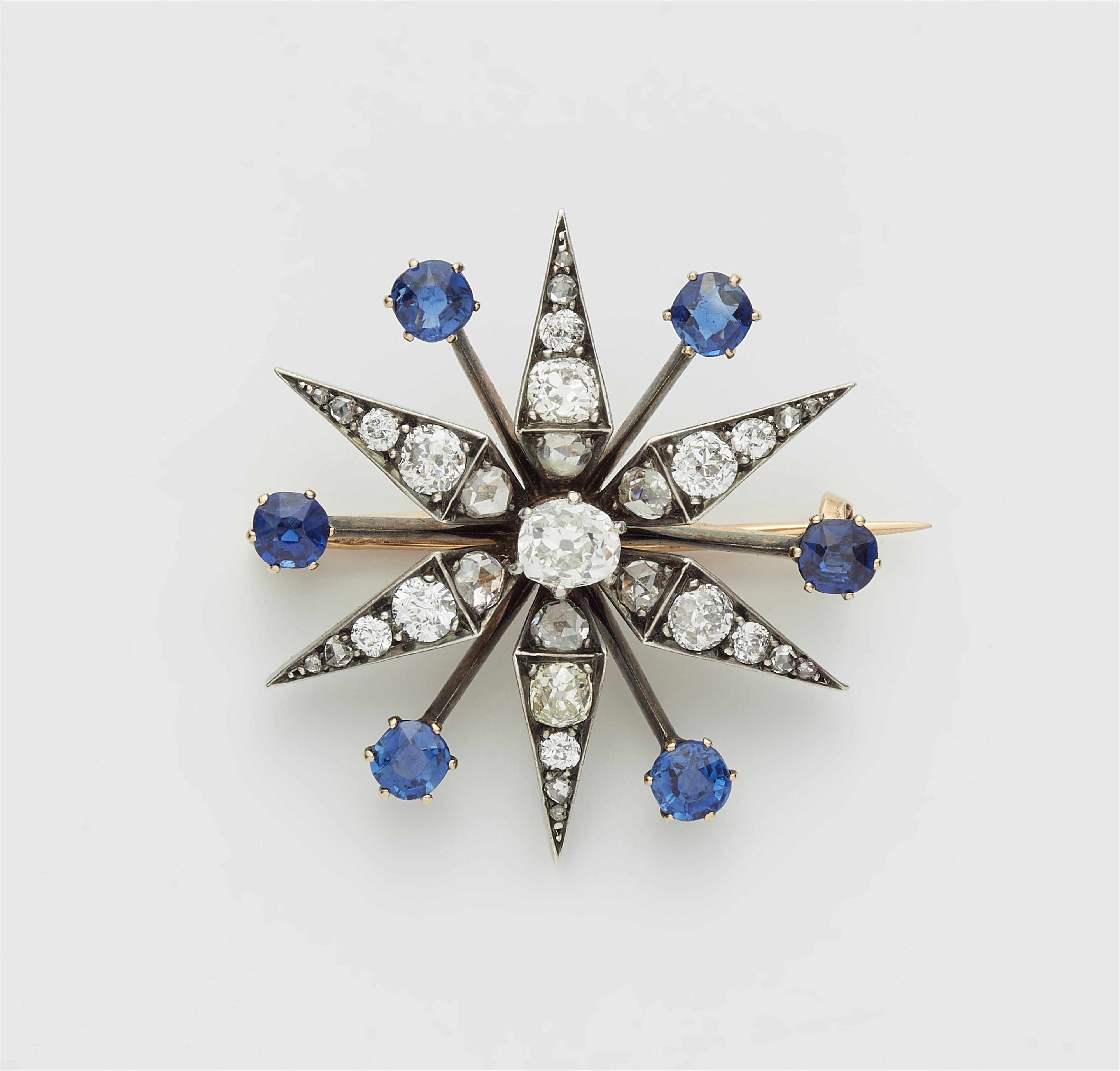 A French Belle Epoque silver 18k gold diamond and sapphire star brooch with detachable mount. - image-1