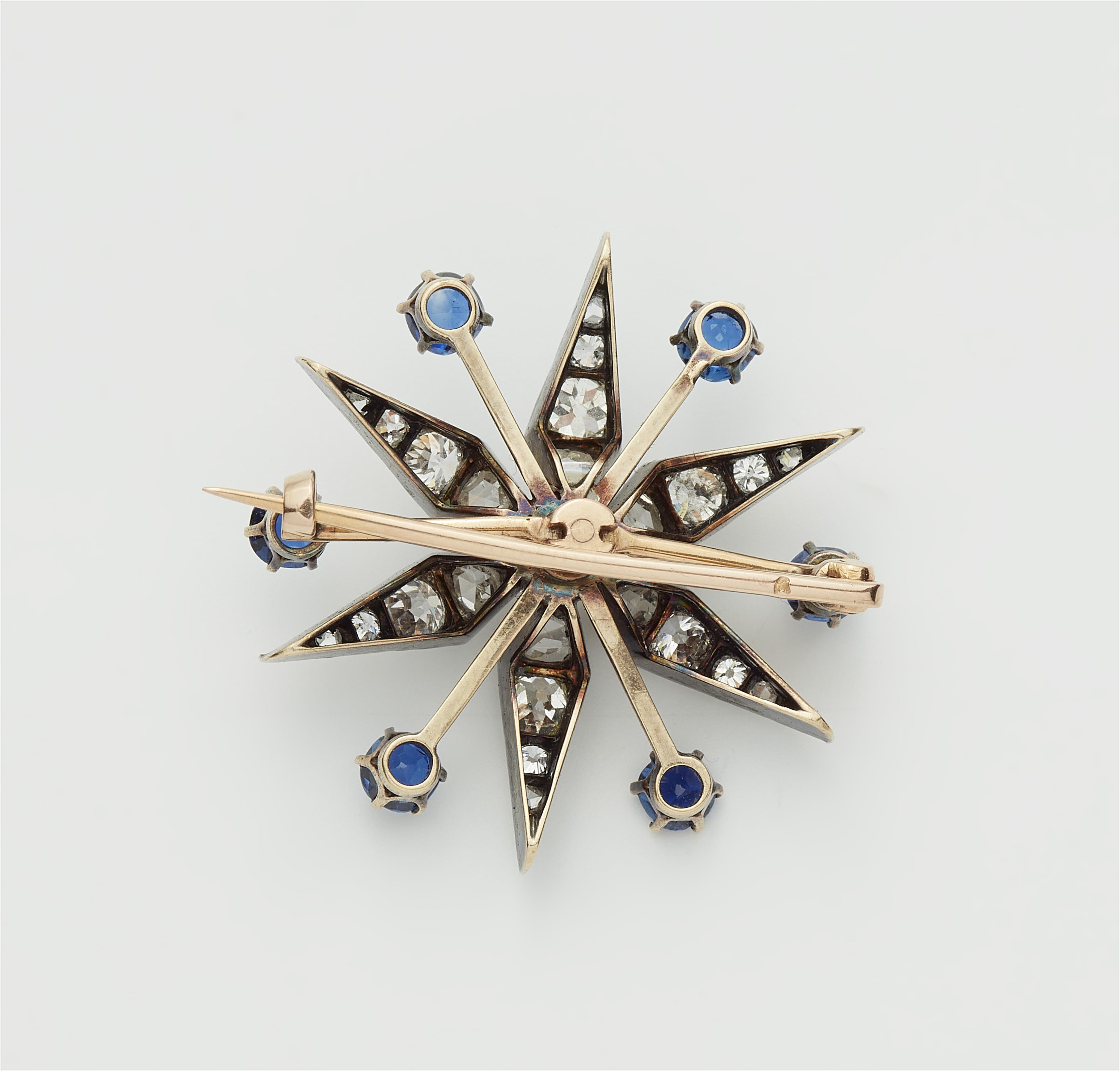 A French Belle Epoque silver 18k gold diamond and sapphire star brooch with detachable mount. - image-2