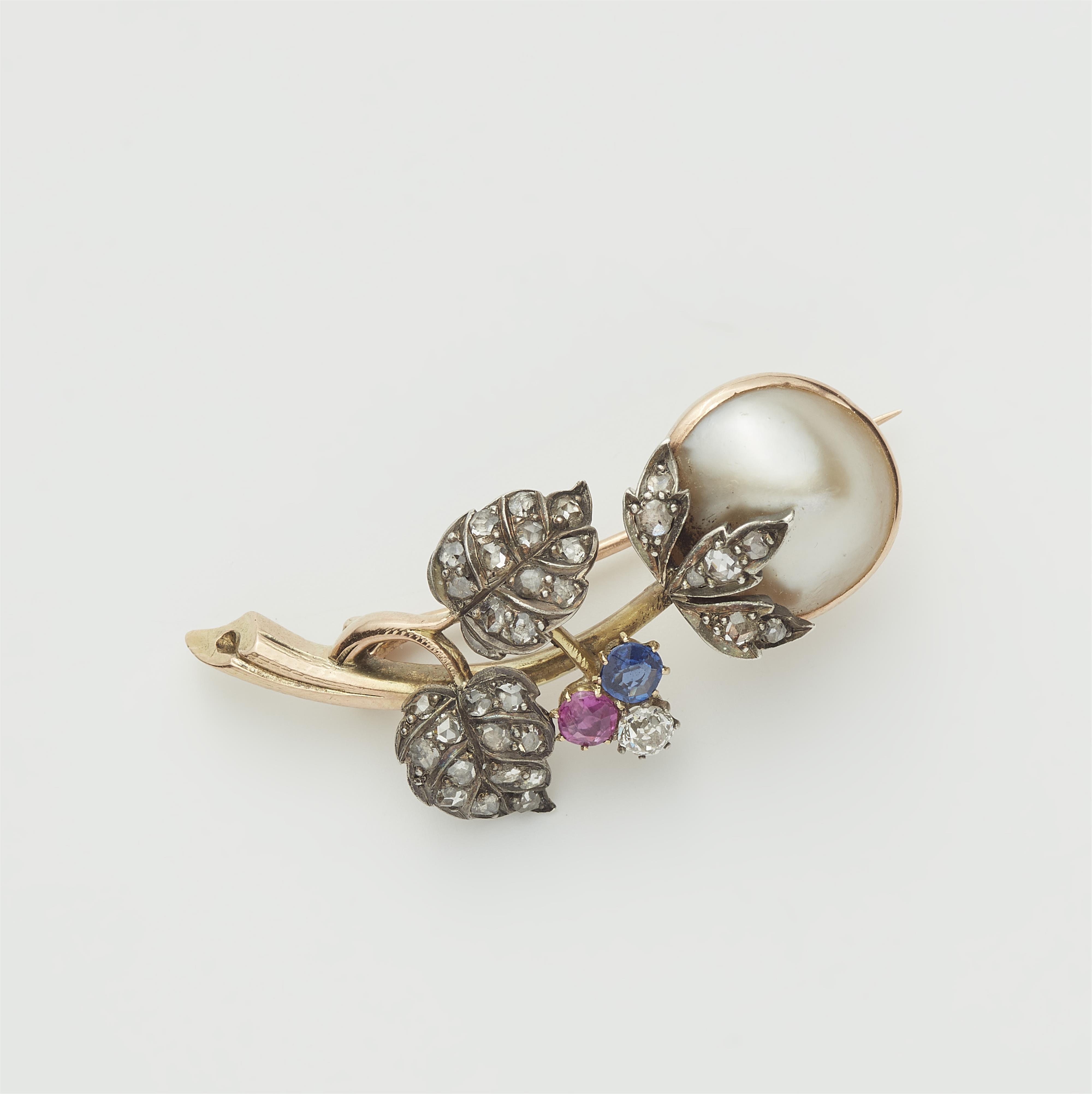 A Belle Epoque 14k gold Mabé pearl, diamond, ruby and sapphire flower brooch. - image-1