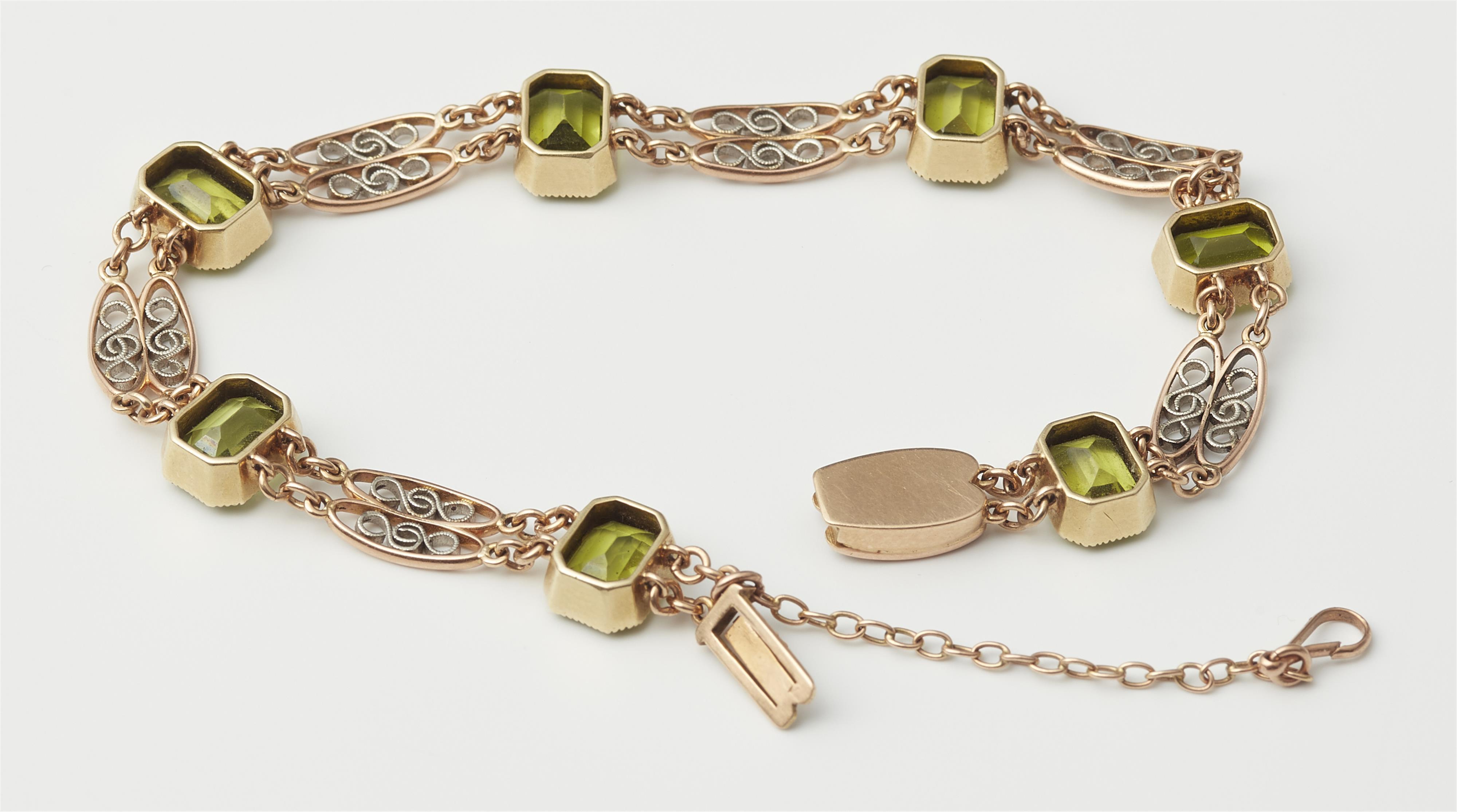 A 14k red gold platinum and peridot bracelet. - image-2