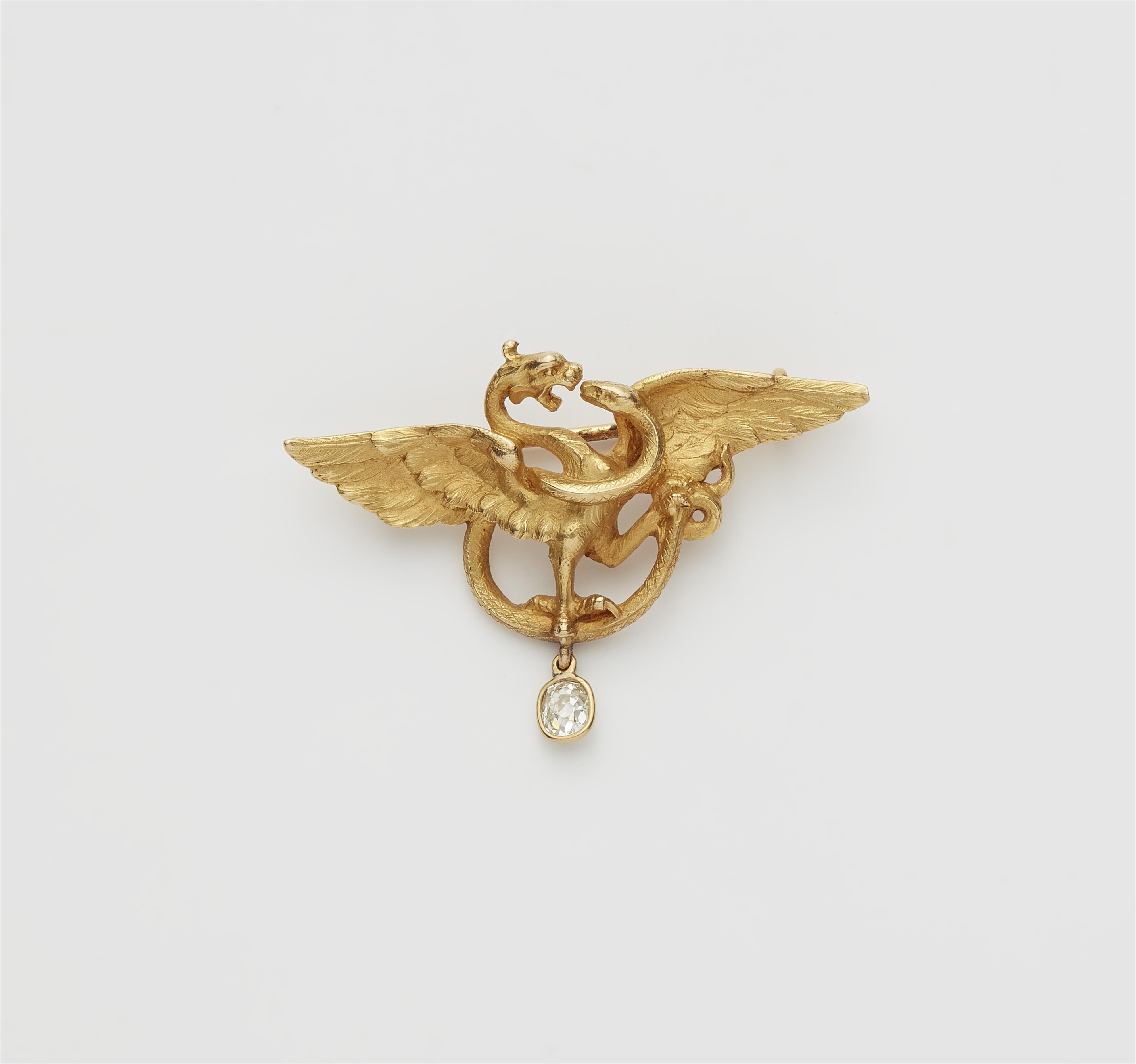 An Art Nouveau 18k gold griffon brooch with diamond droplet. - image-1