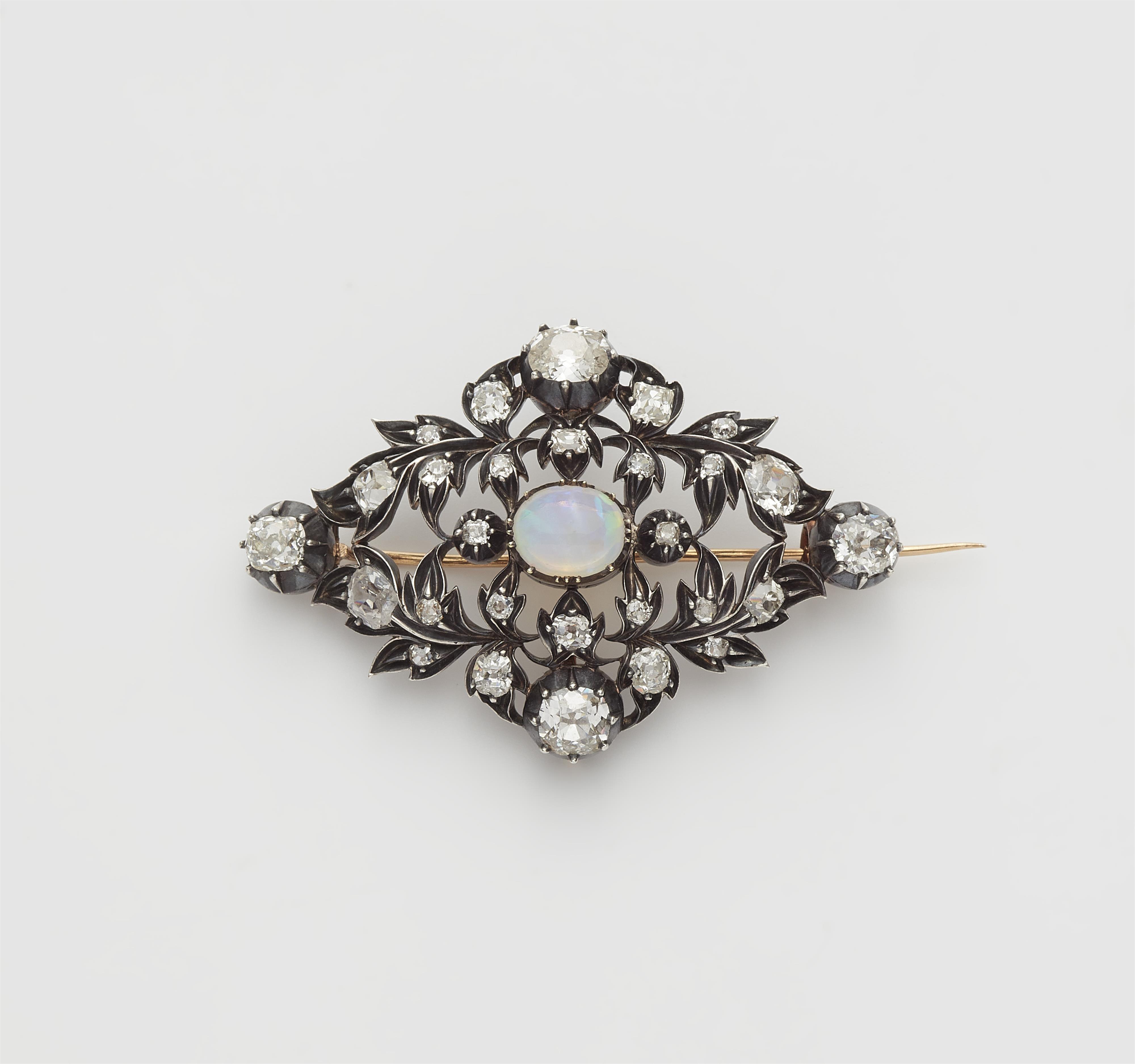 A silver 18k gold diamond and opal openwork brooch. - image-1