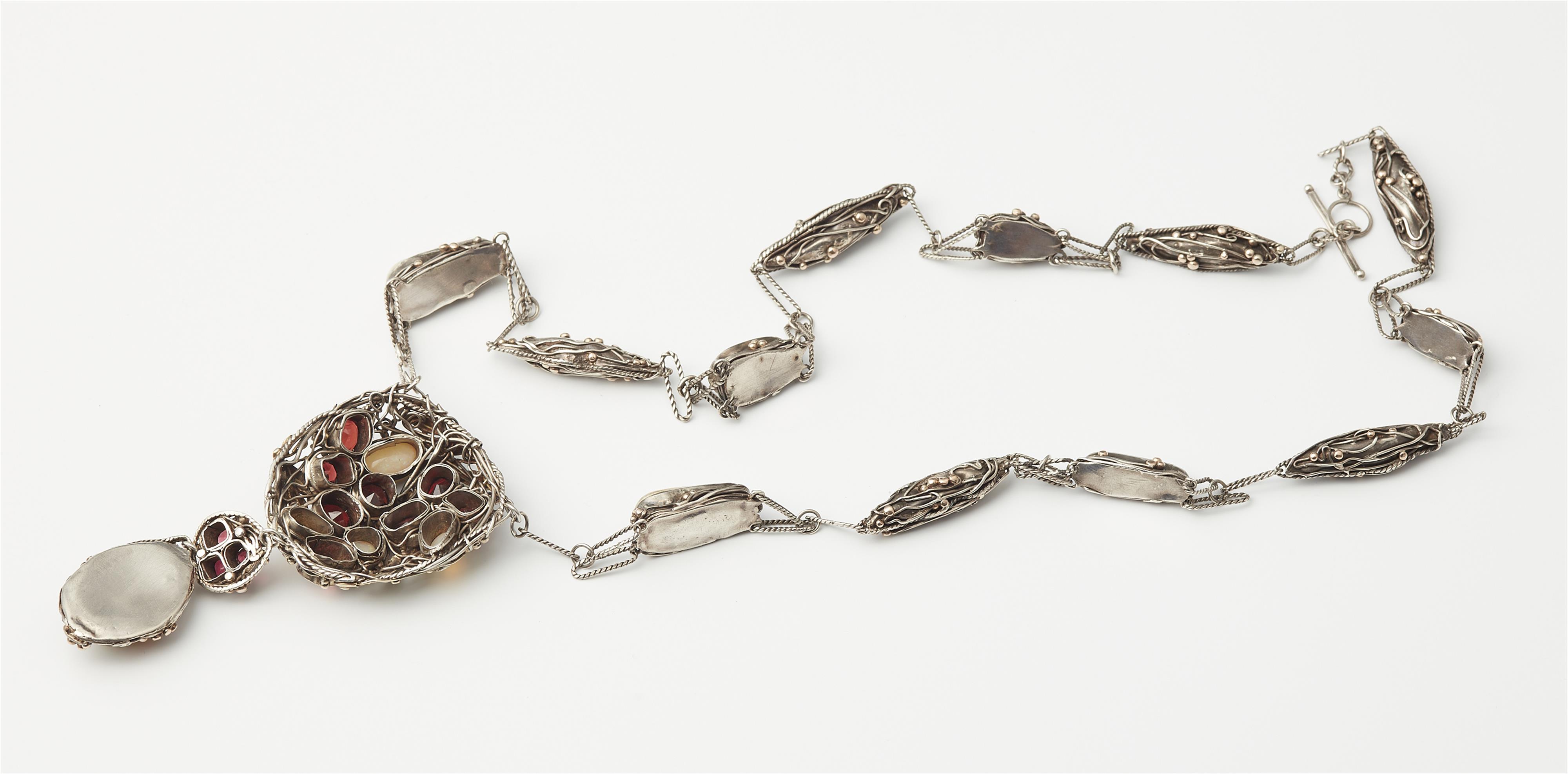 A rare silver gold granule and translucent enamel Arts and Crafts sautoir necklace set with opals, garnets and spinels in the manner of Dorrie Nossiter, ca. 1925. - image-4