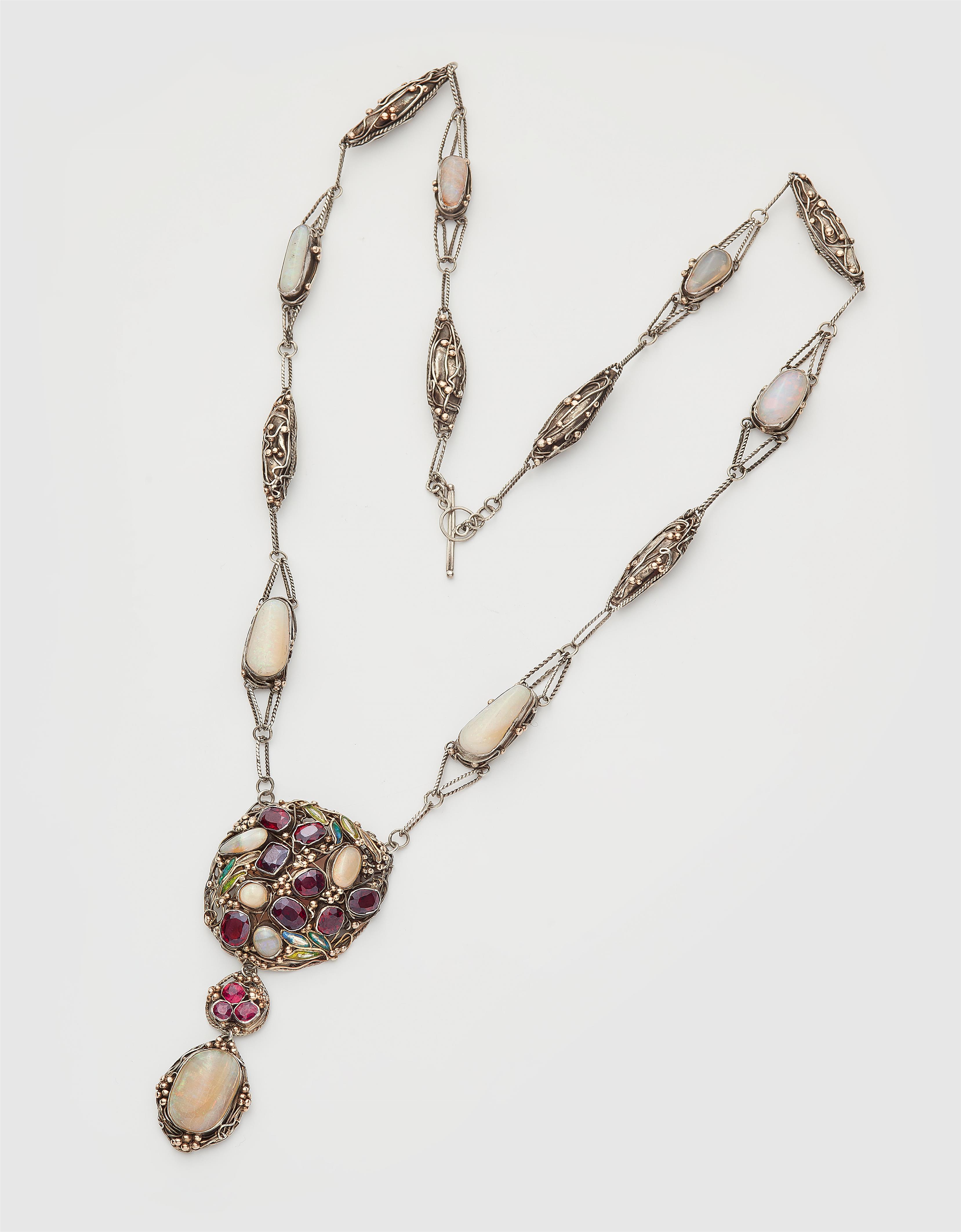 A rare silver gold granule and translucent enamel Arts and Crafts sautoir necklace set with opals, garnets and spinels in the manner of Dorrie Nossiter, ca. 1925. - image-1