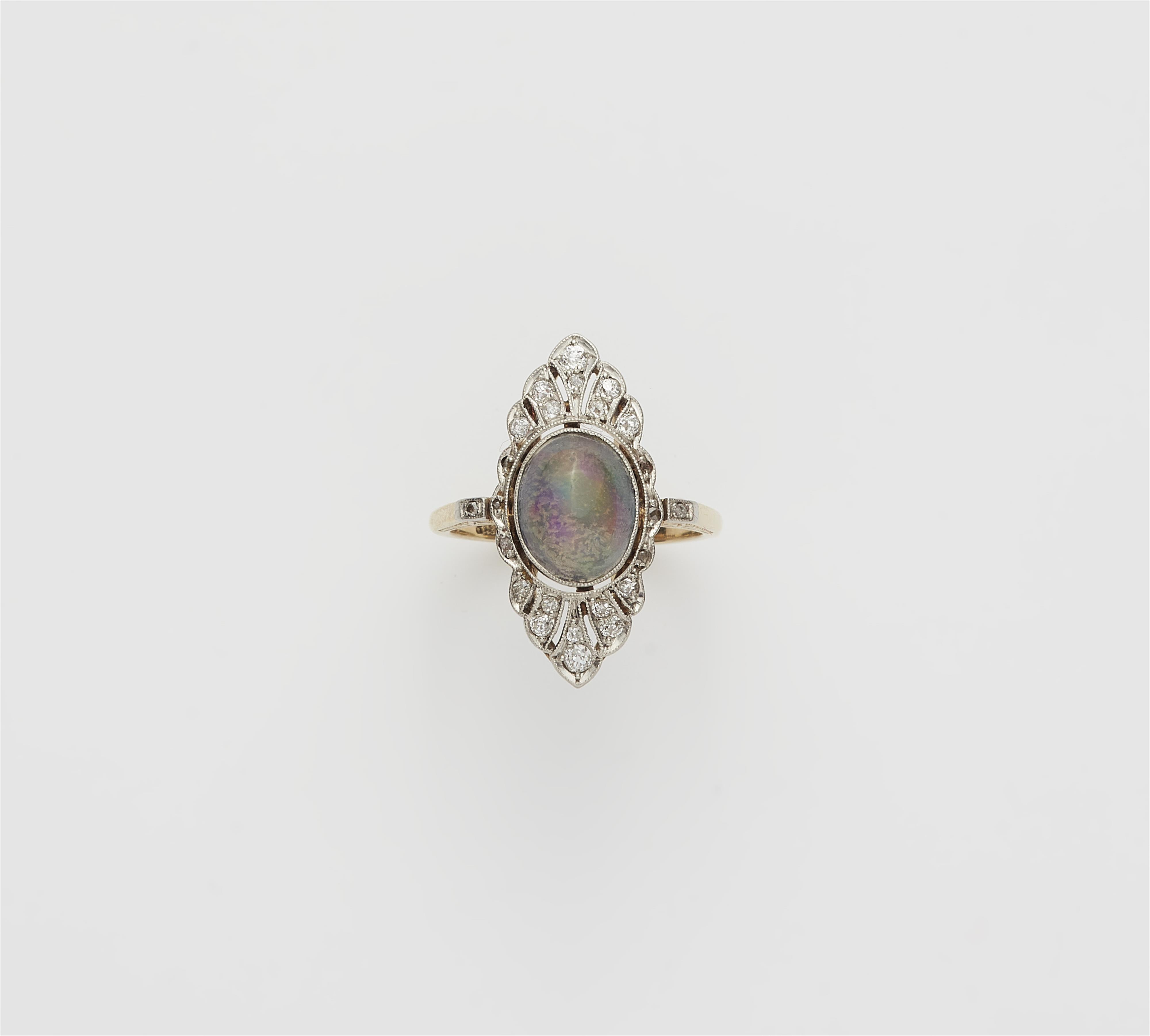 A Belle Epoque 14k gold platinum diamond and opal cabochon Marquise ring. - image-1