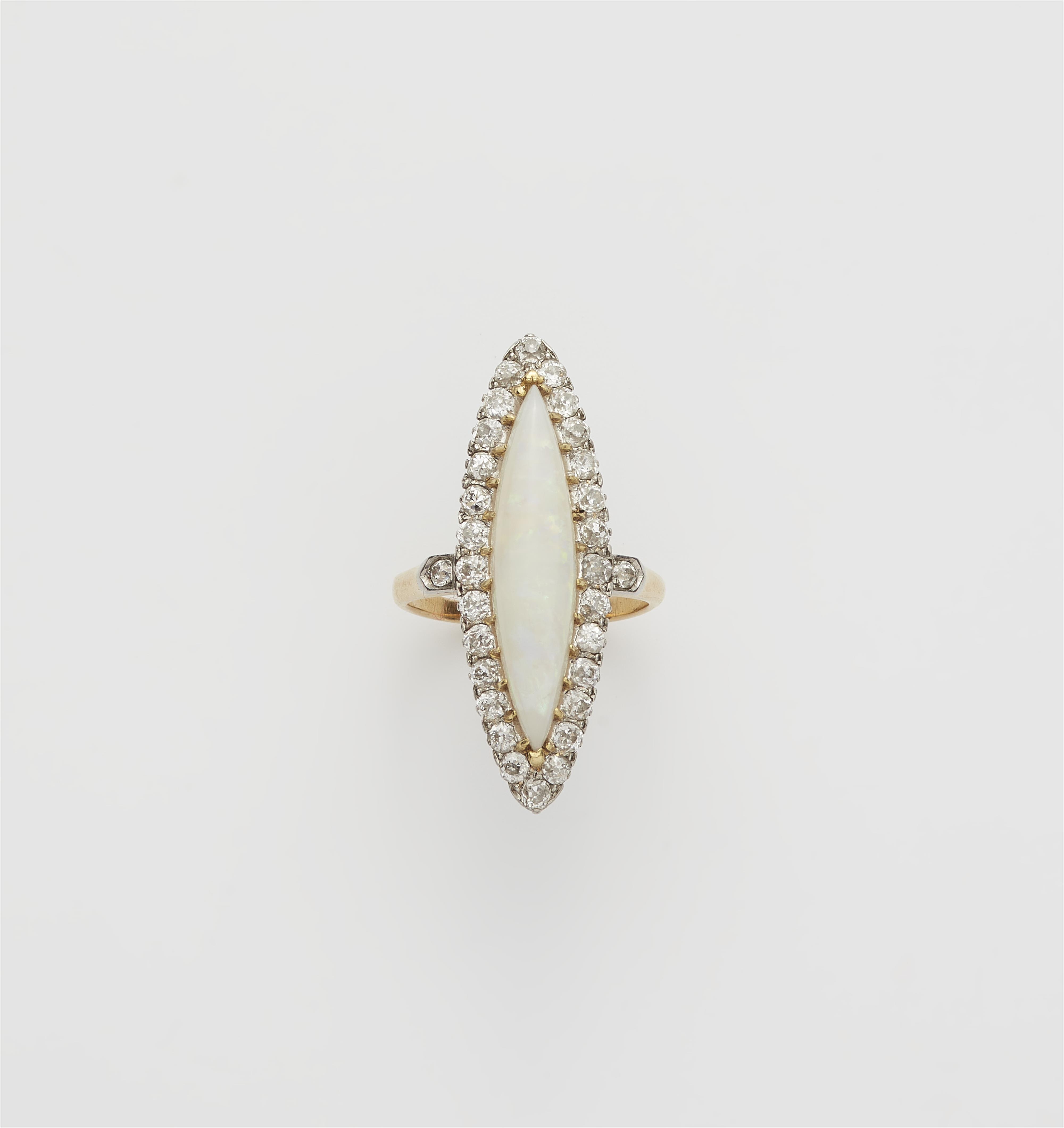 A French Belle Epoque 18k gold diamond and milky opal Marquise ring. - image-1