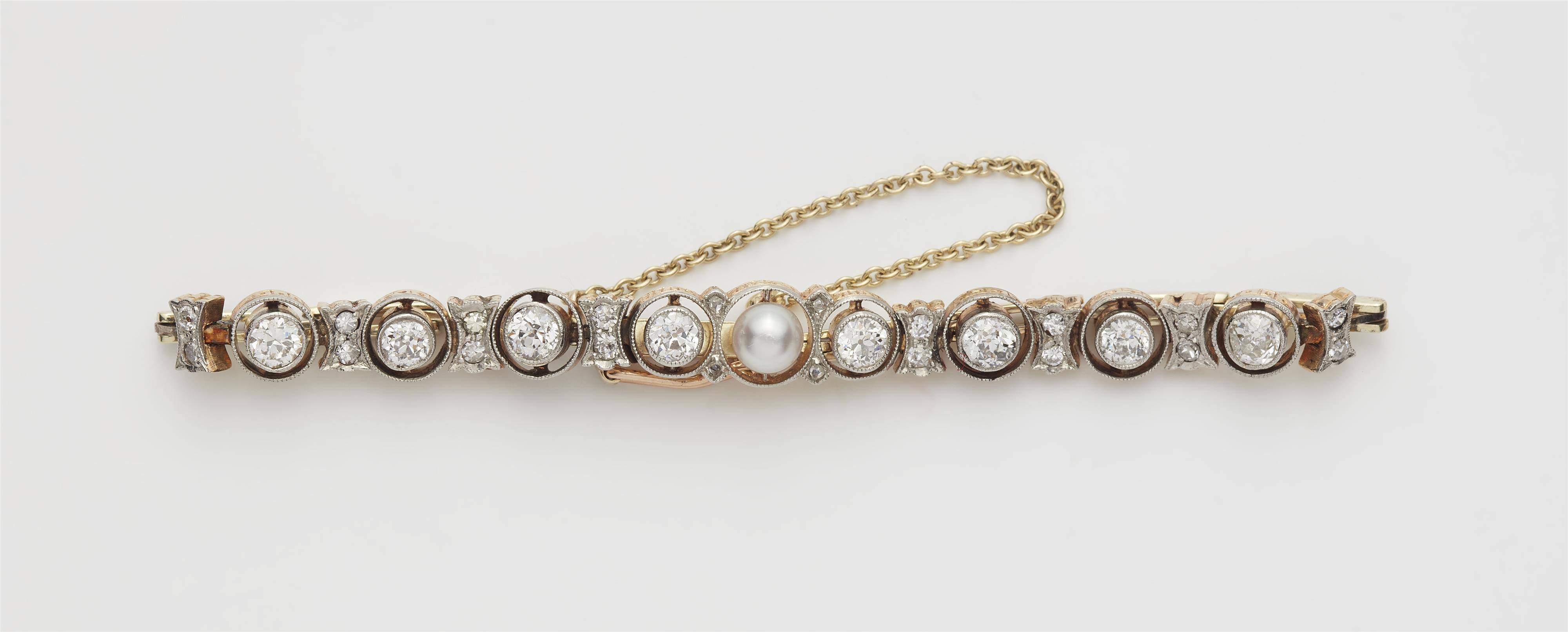 An 14k gold platinum diamond and pearl tennis bracelet. - image-1