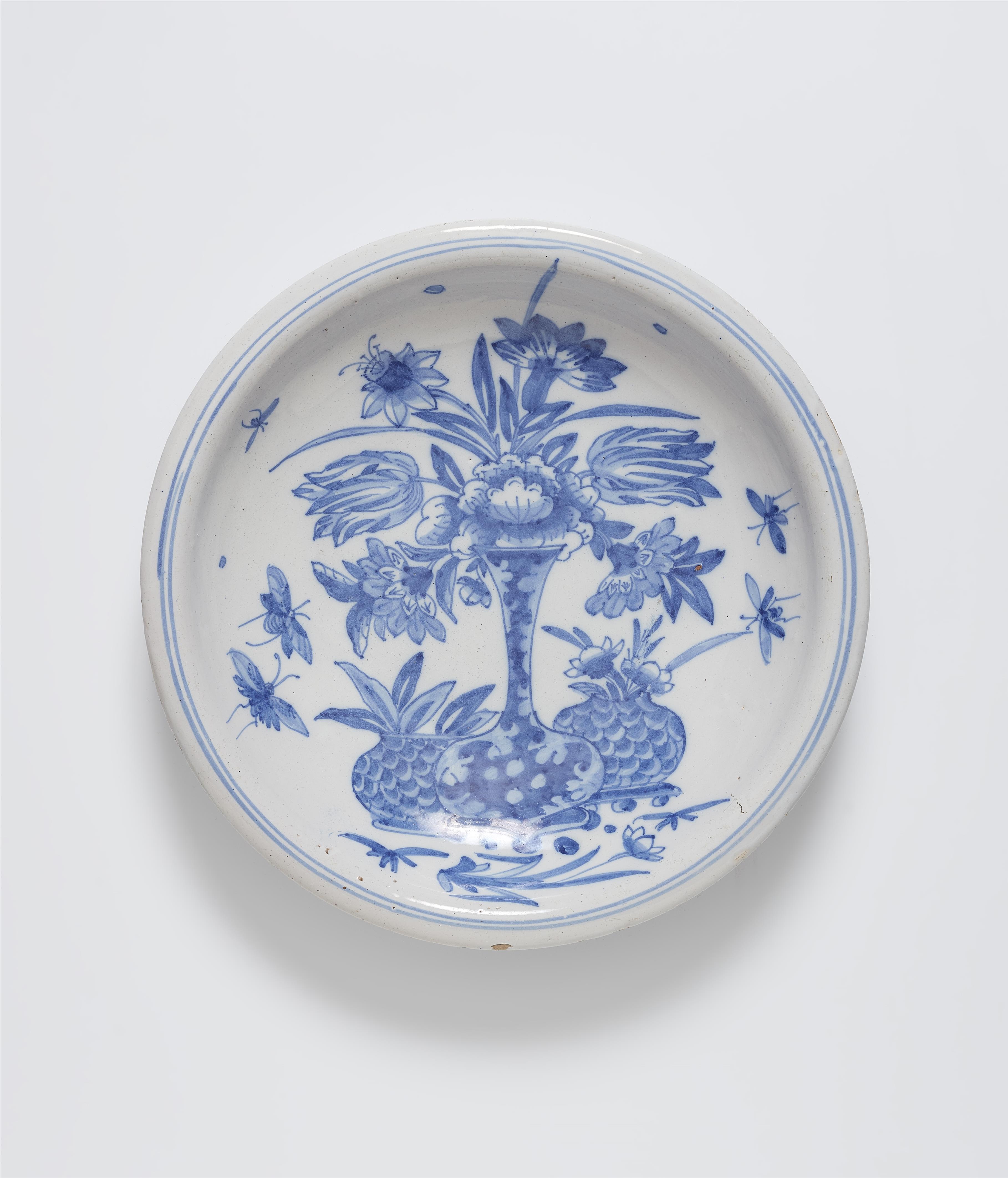 A faience dish with a still life motif - image-1