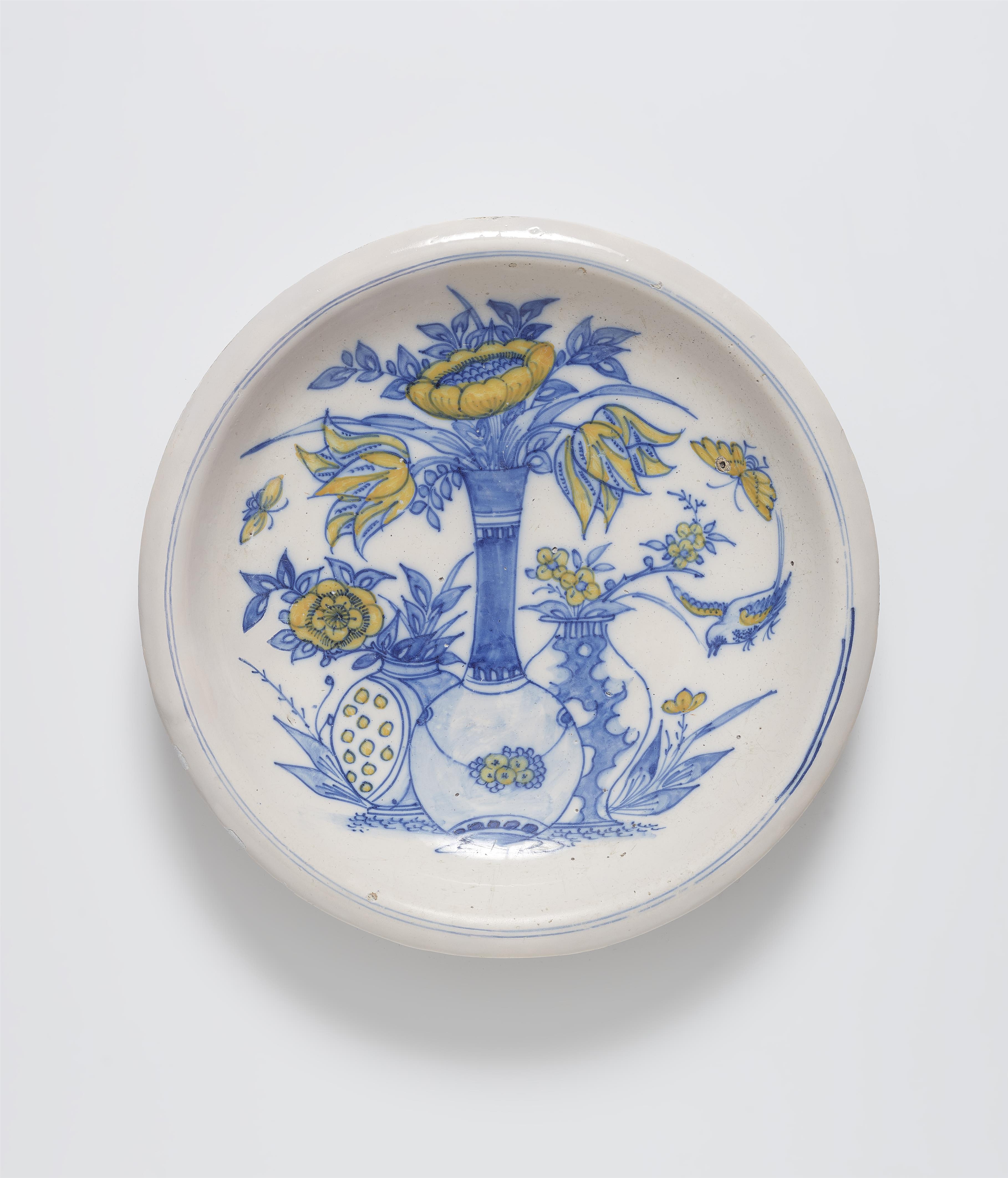 A faience dish painted in blue and yellow - image-1