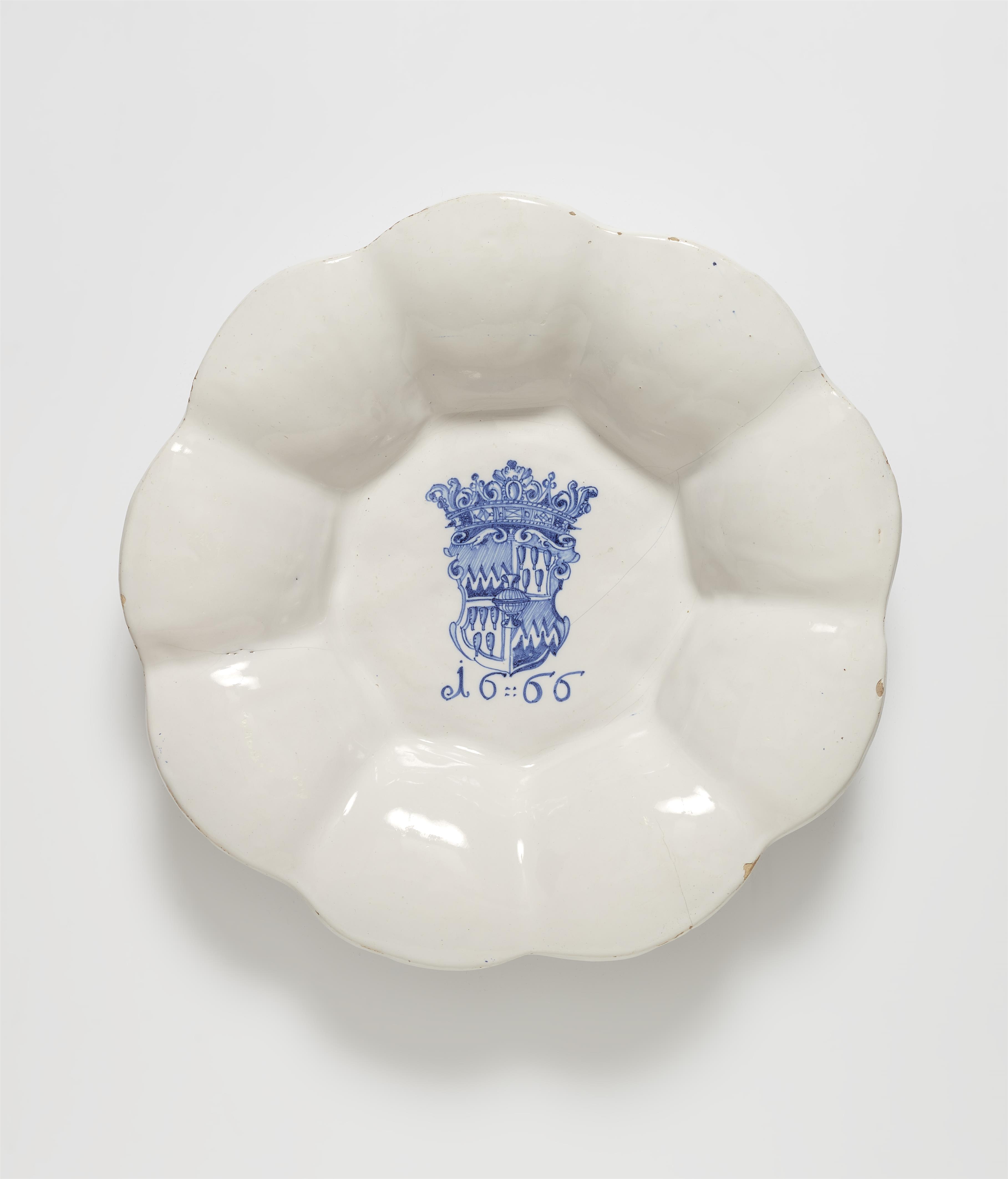 A dated faience dish with the Schenck zu Limburg coat of arms - image-1
