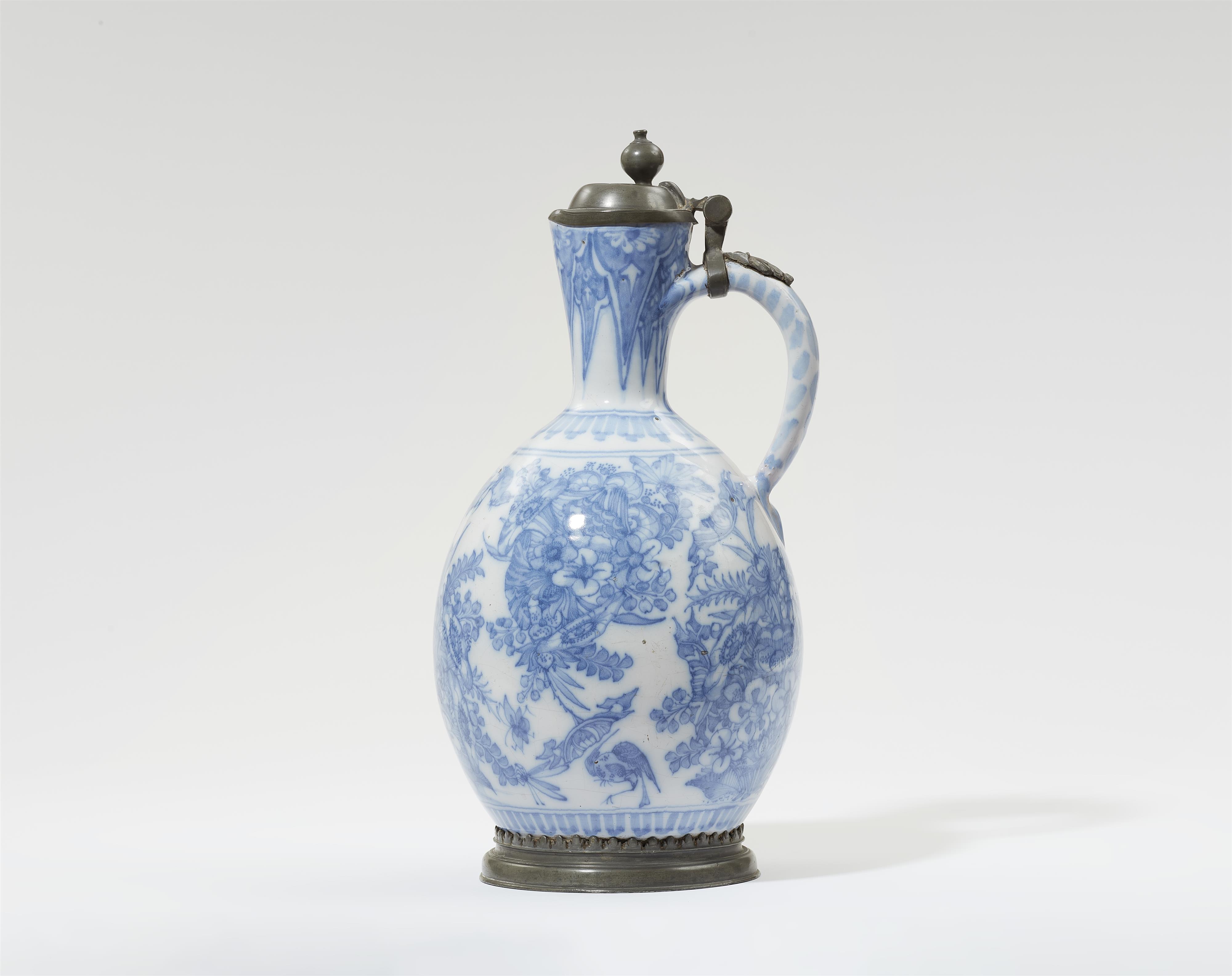 A faience jug with "swamp flower" motifs - image-1