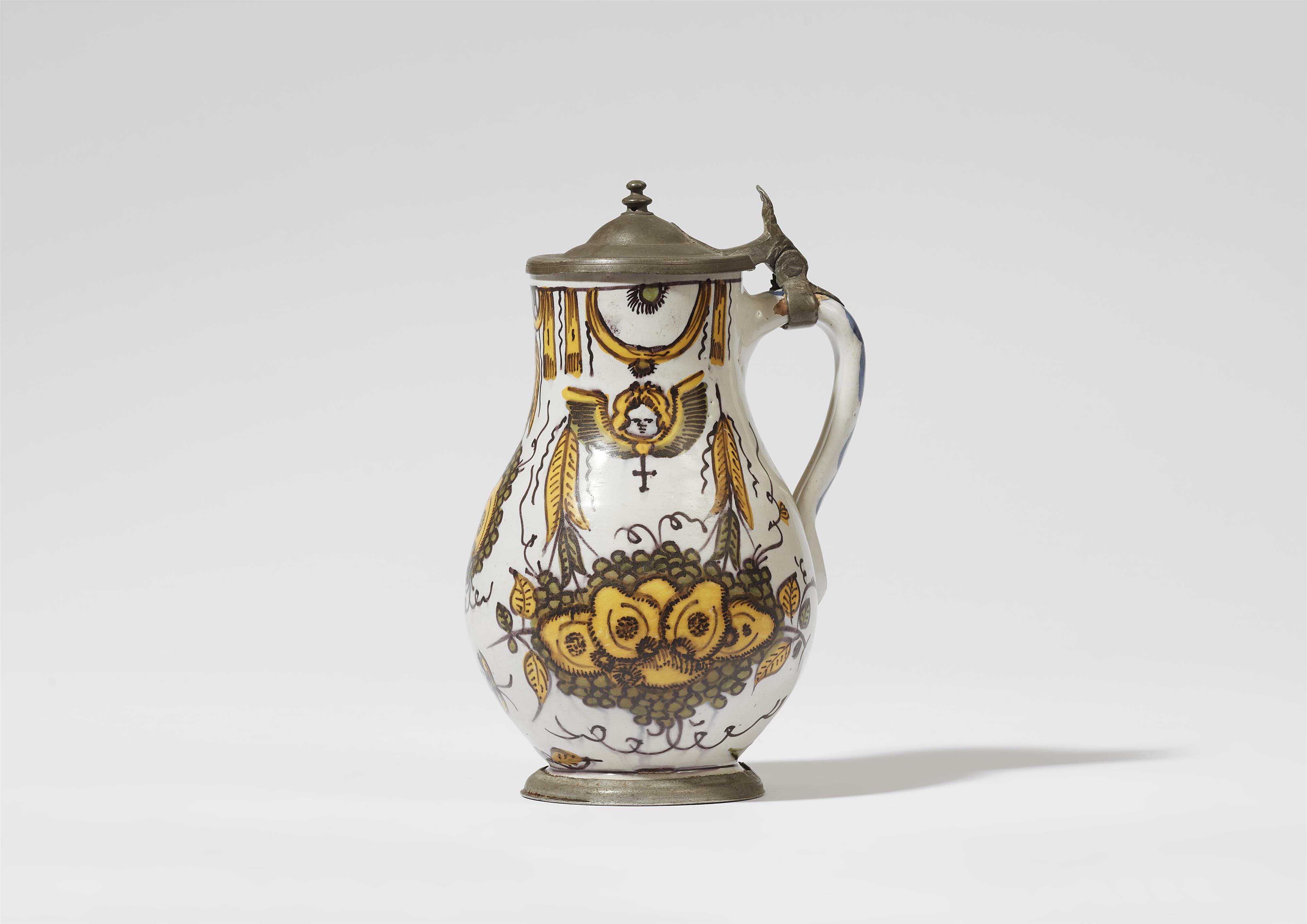 A faience jug with a fruit still life and angels - image-1