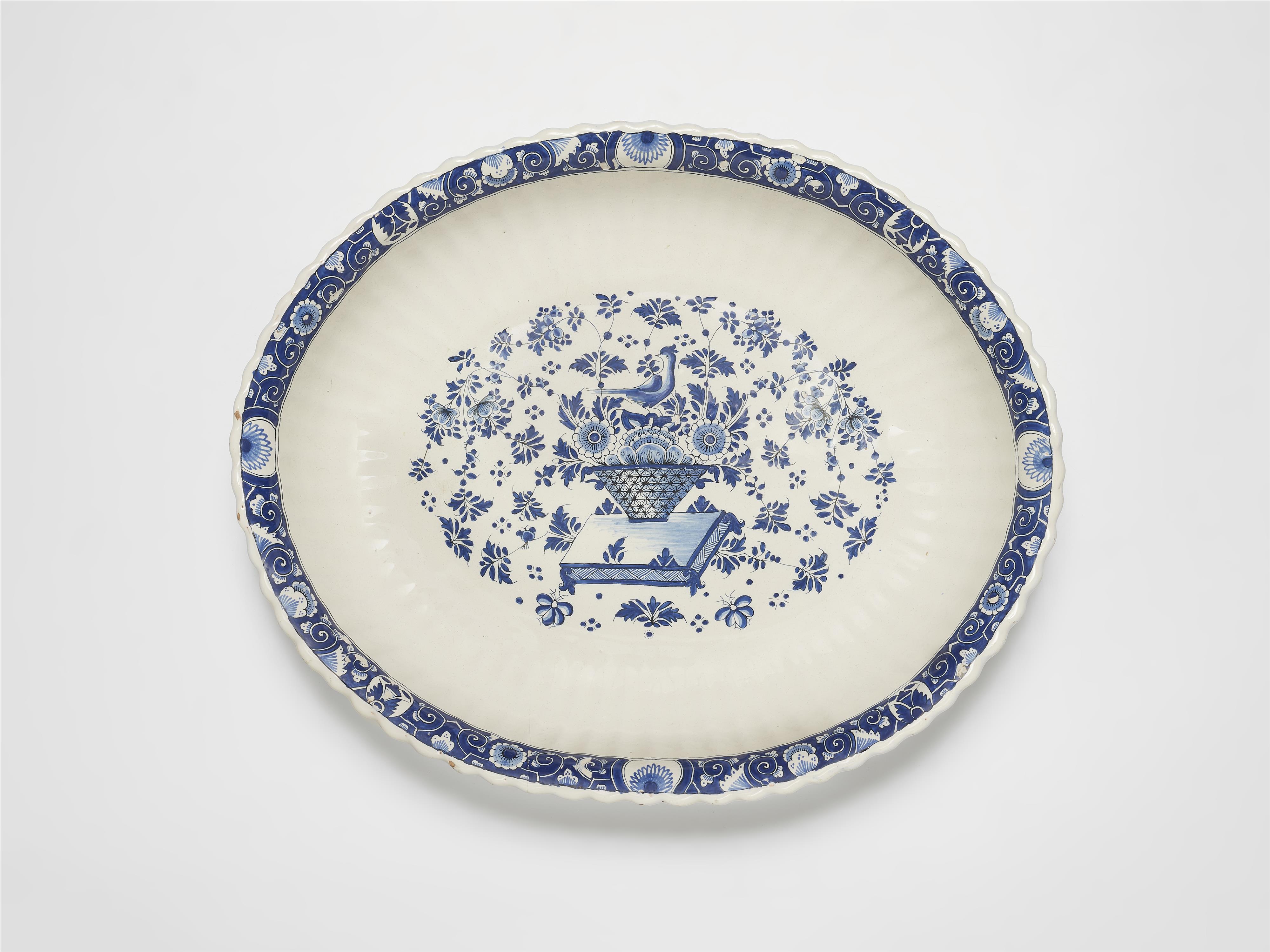 An oval Strasbourg faience dish with decor in the manner of Bérain - image-1