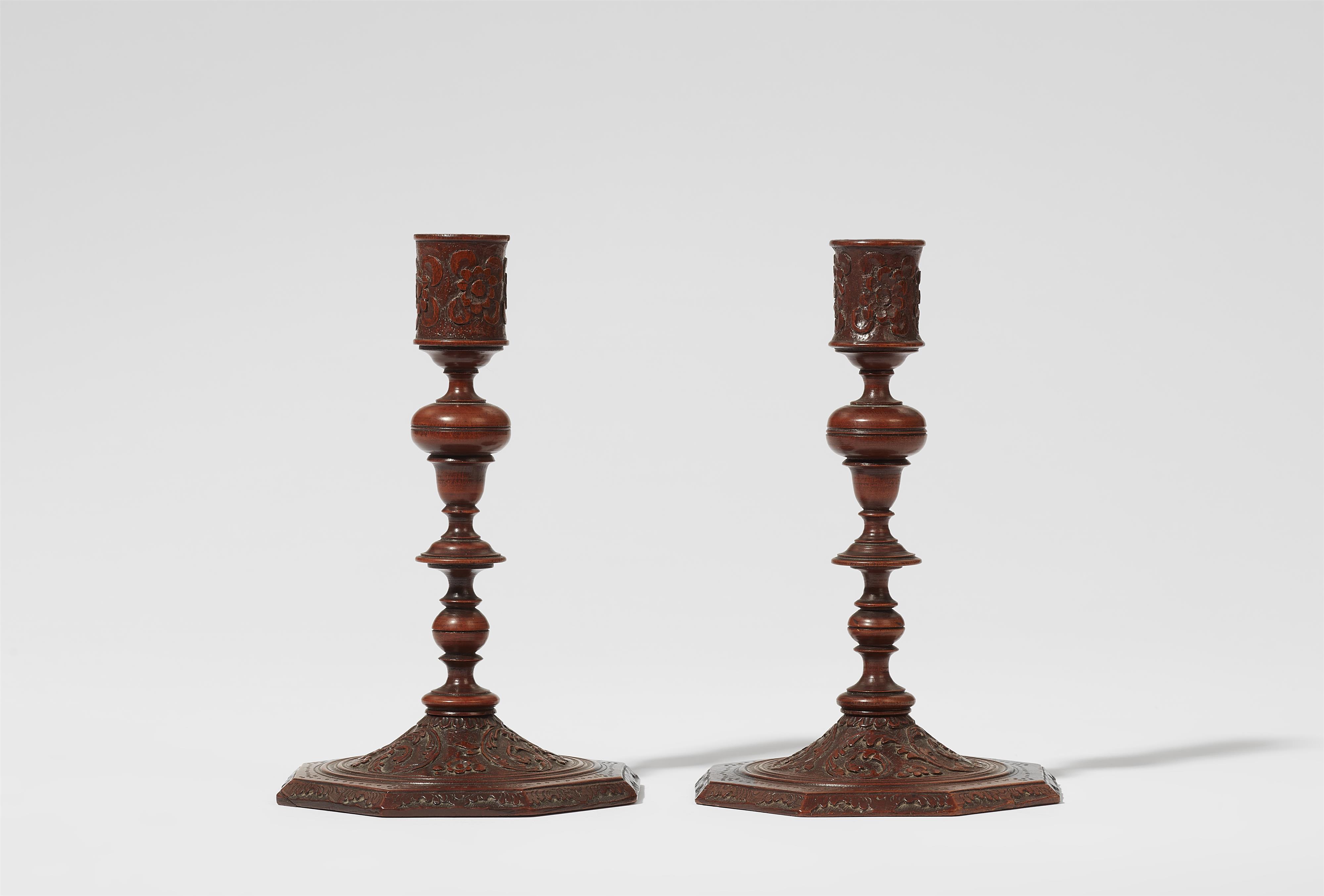 A museum quality pair of carved wood candlesticks - image-1