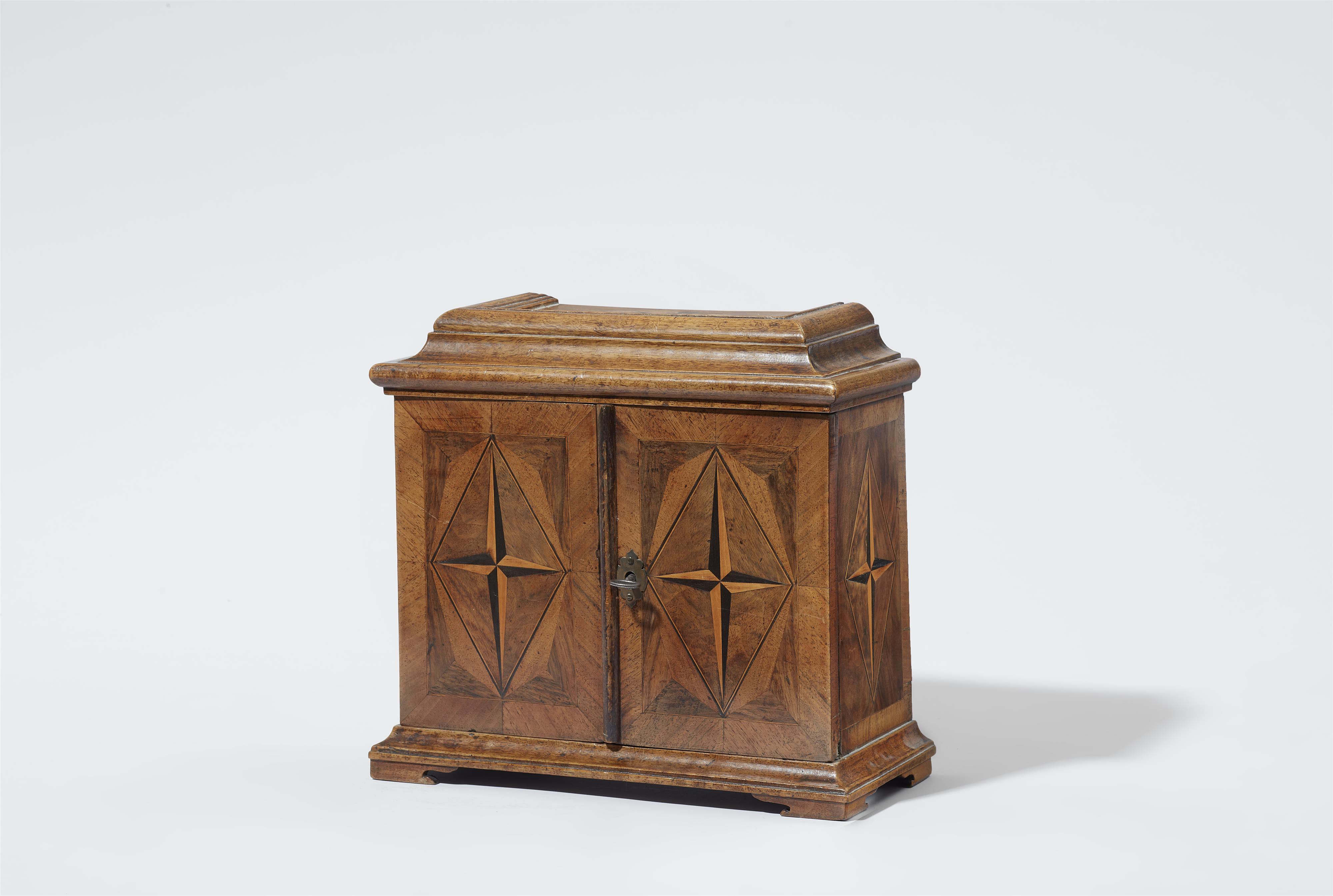 A small cabinet chest with star inlays - image-1