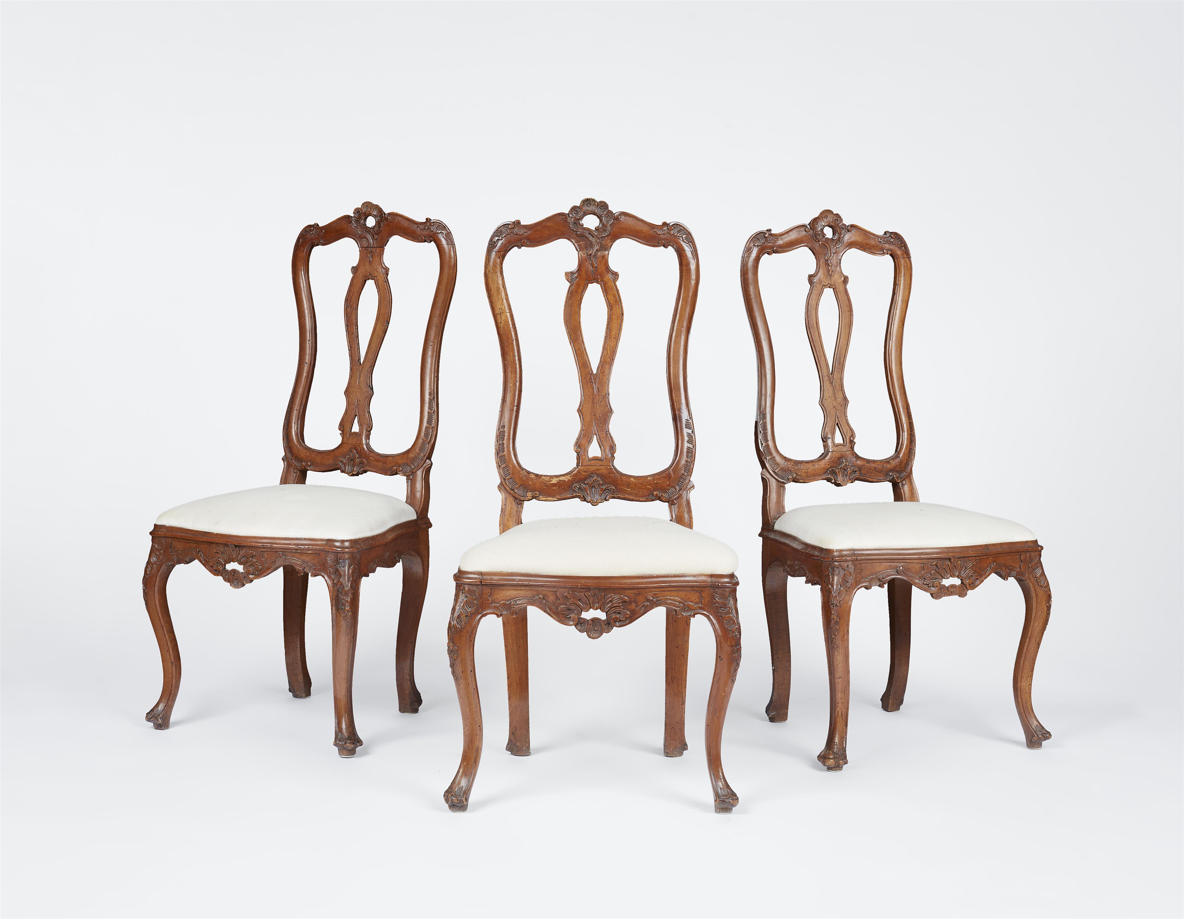 Three German Rococo carved walnut chairs - image-1