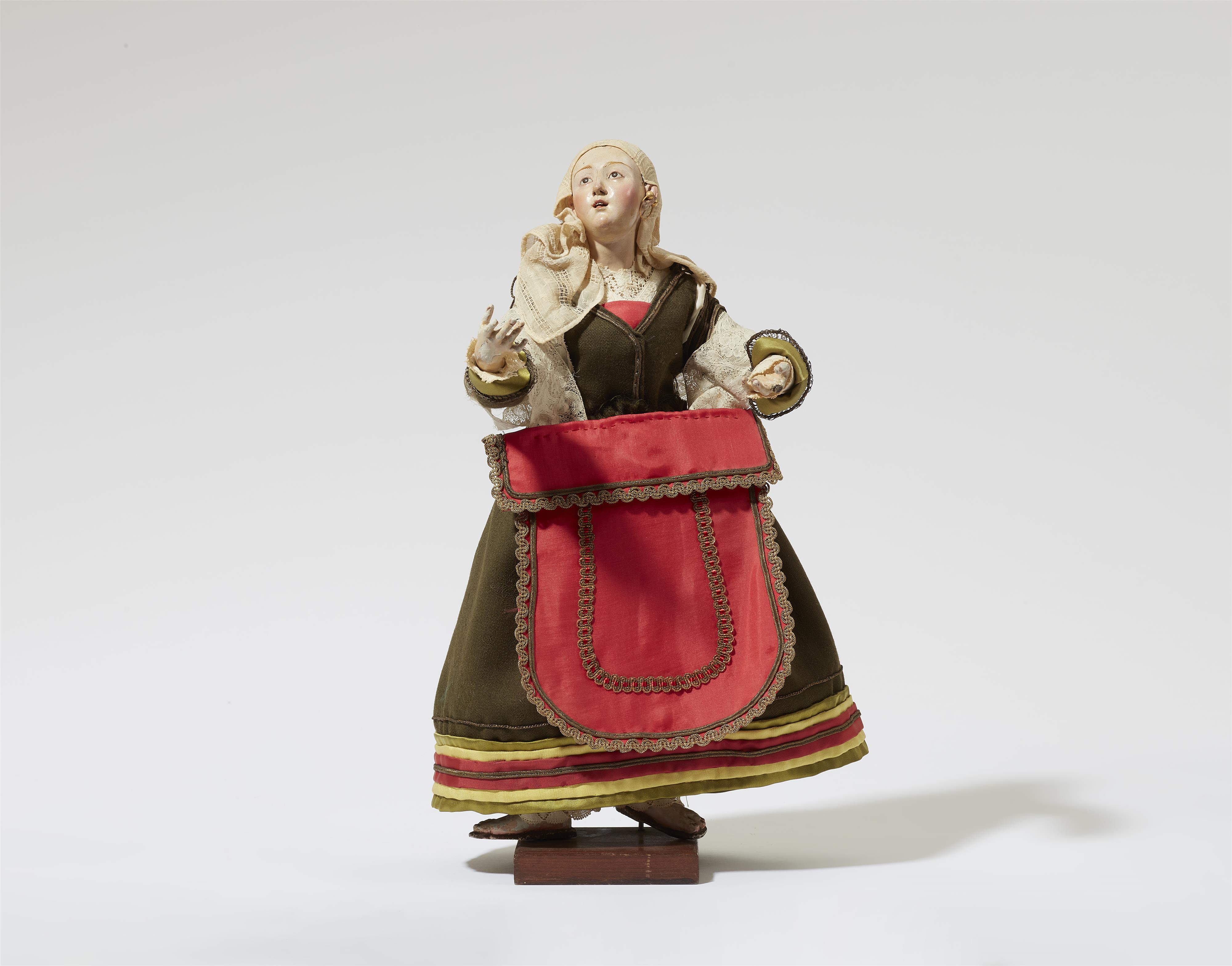 A figure of a young woman from a Nativity scene - image-1