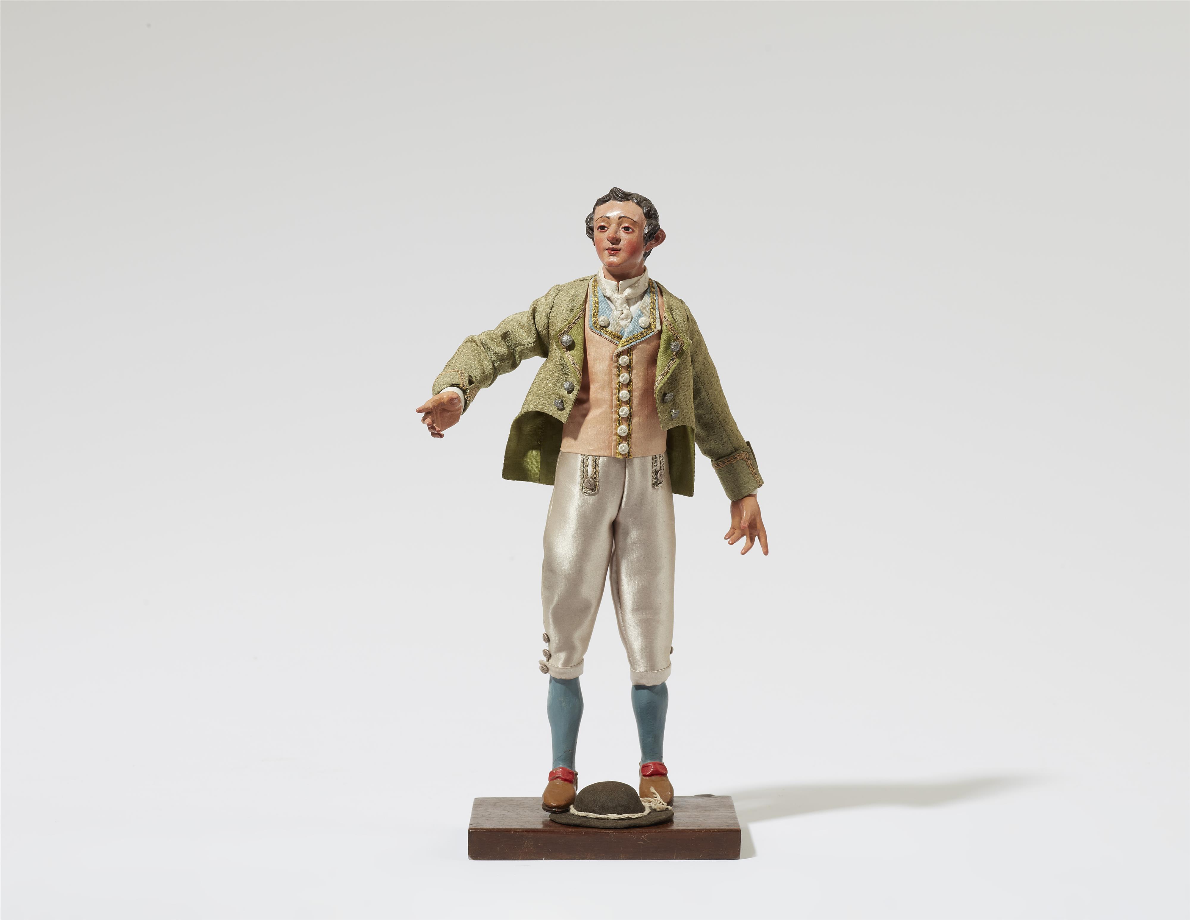 A figure of an elegant gentleman from a Nativity scene - image-1