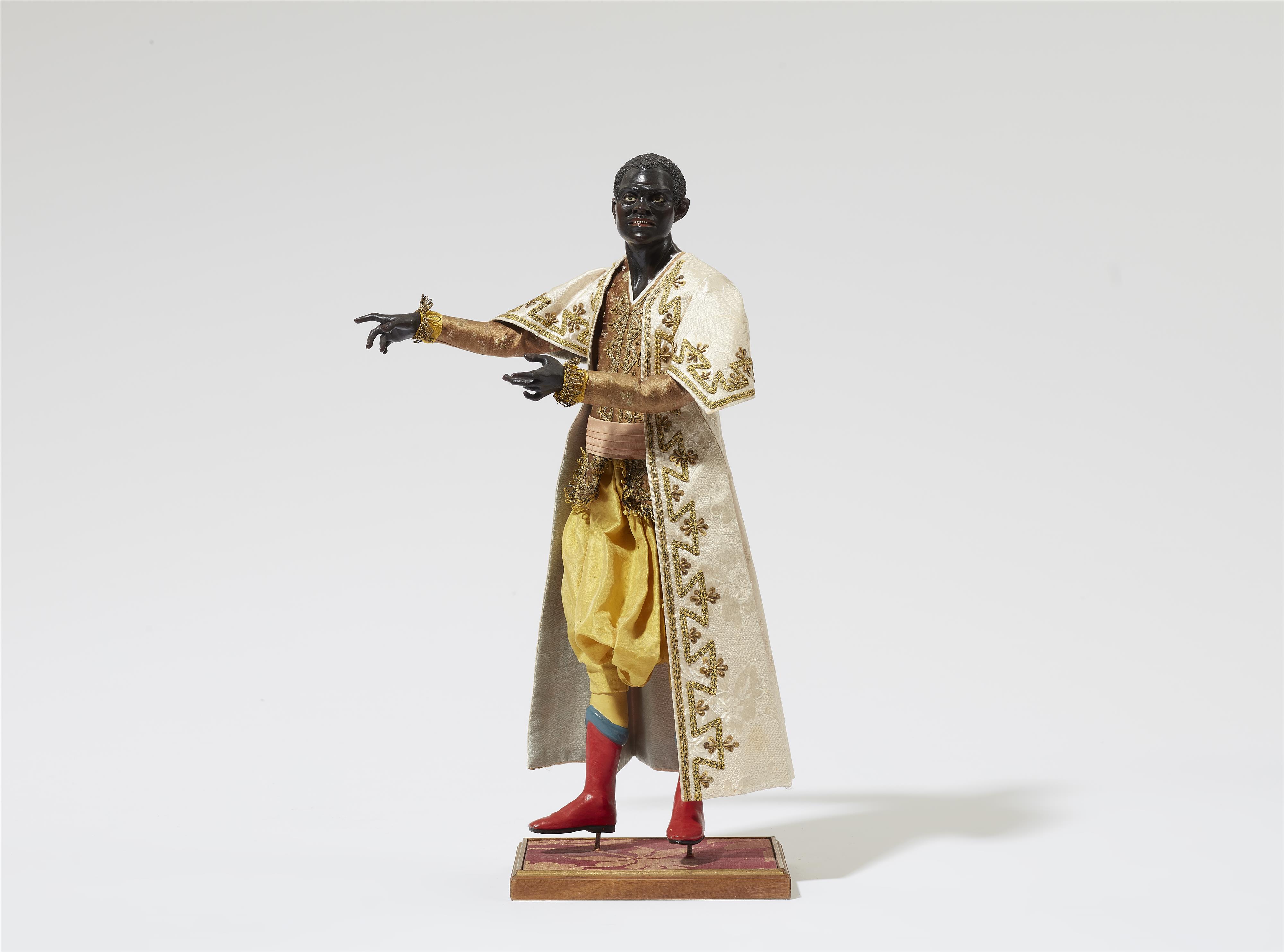 A figure from the retinue of King Balthasar a from a Nativity scene - image-1