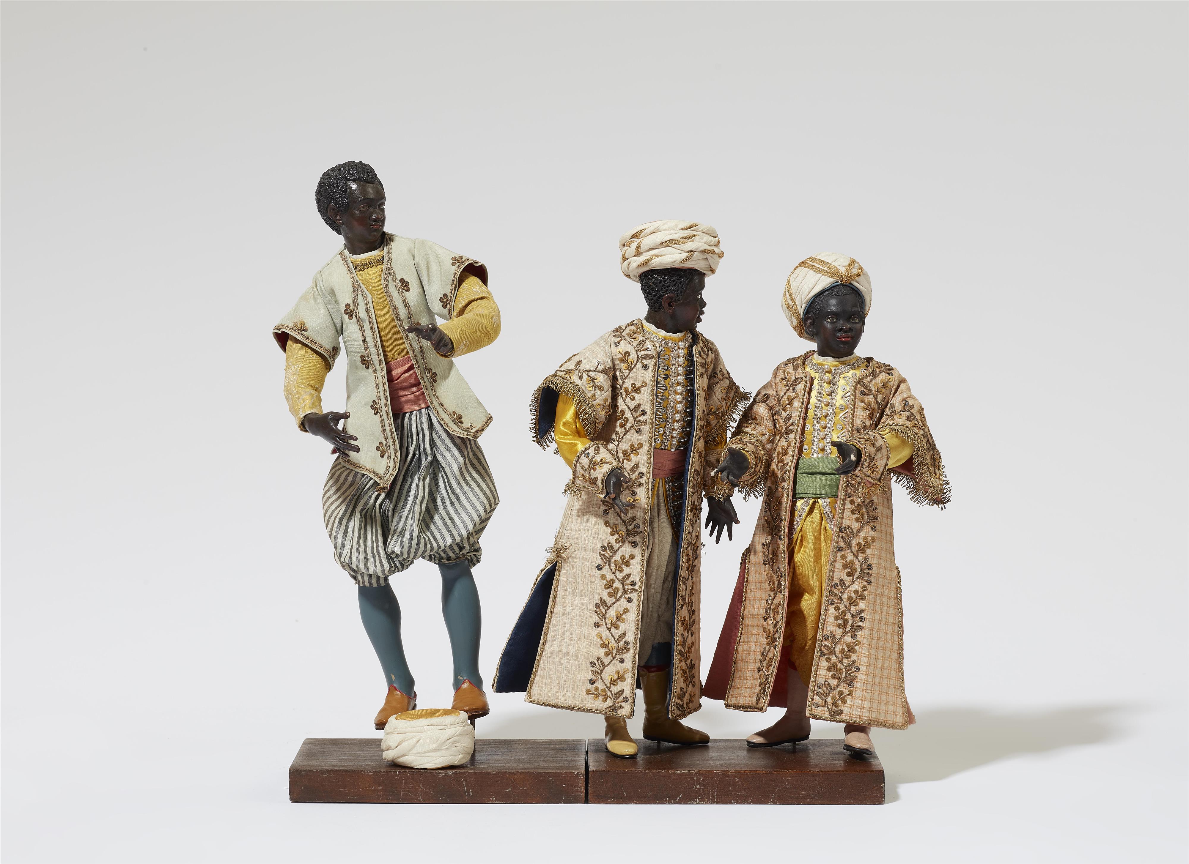 Three figures of young men from the retinue of King Balthasar  from a Nativity scene - image-1