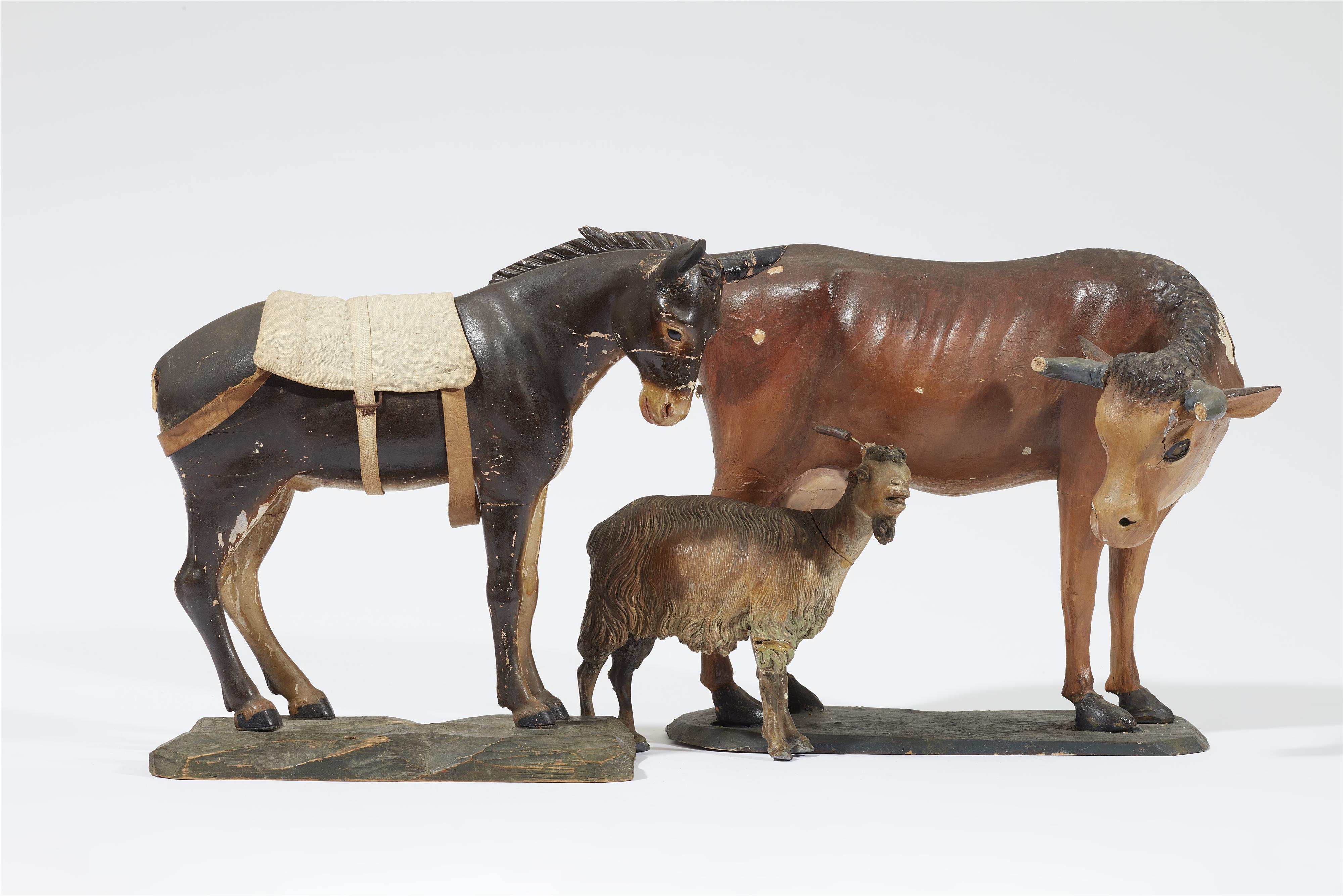 Models of a cow, donkey, and goat from a Nativity scene - image-1