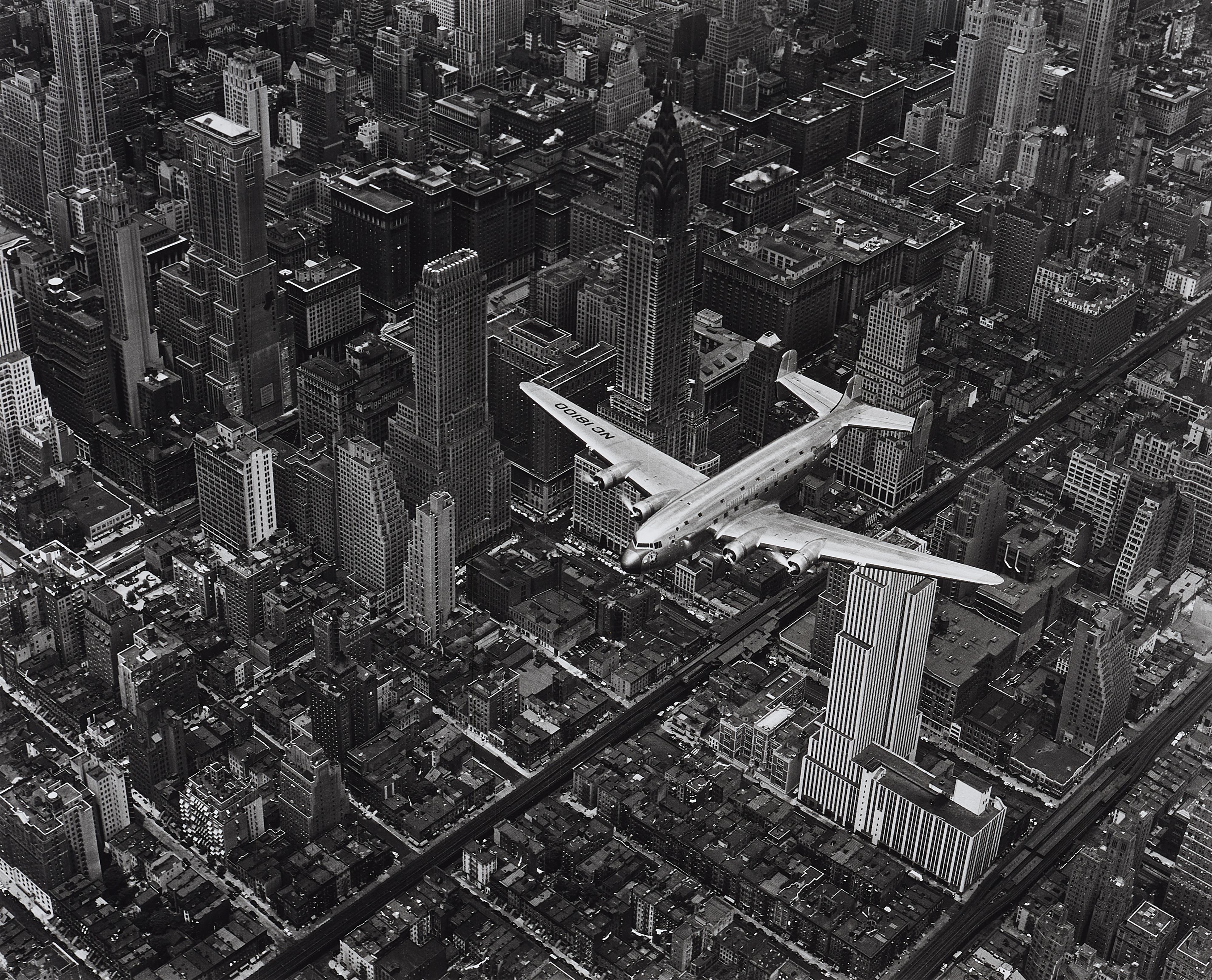 Margaret Bourke-White - A DC4 flying over New York City - image-1