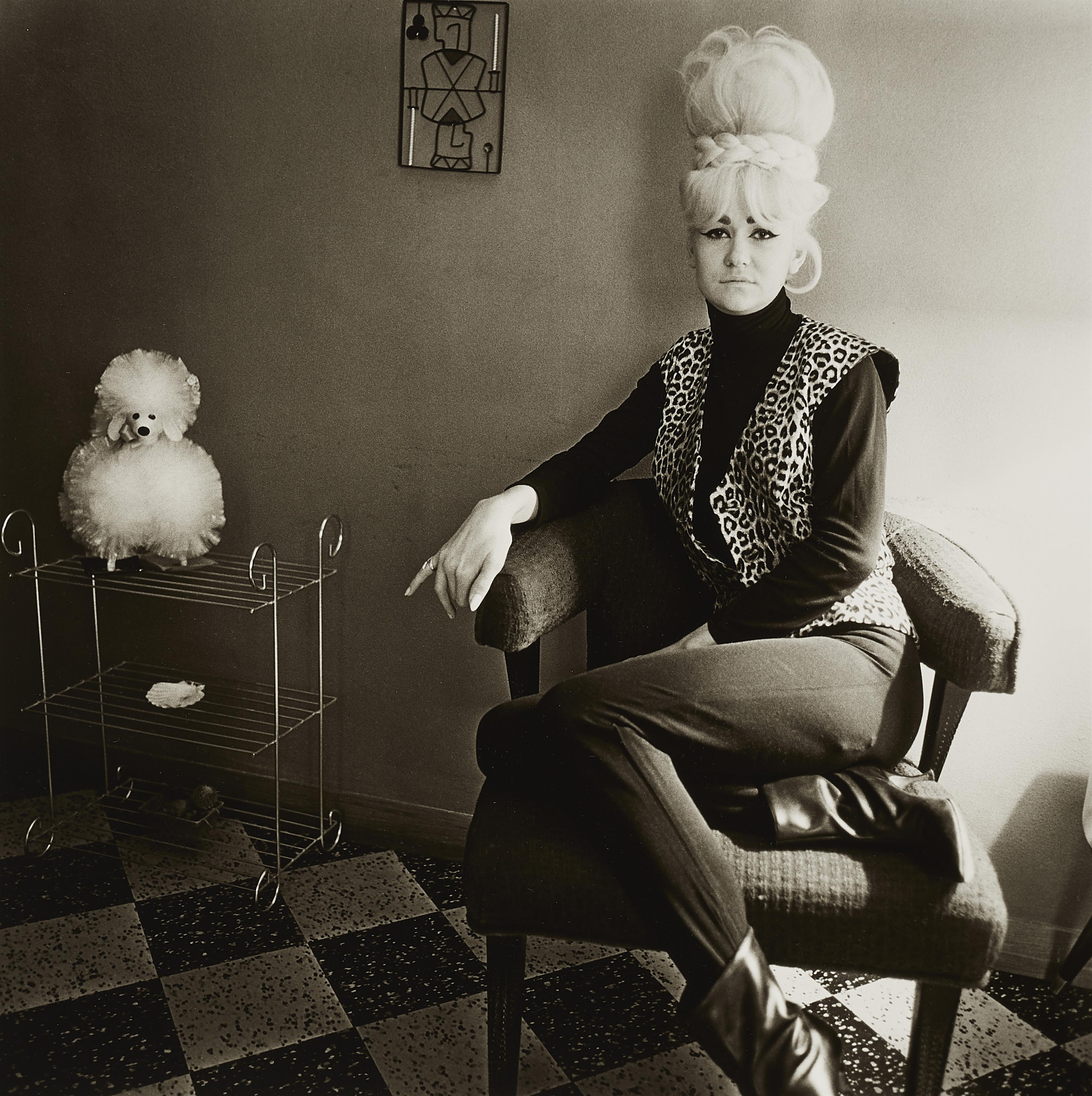 Diane Arbus - Lady Bartender at Home with a Souvenir Dog, New Orleans, LA - image-1