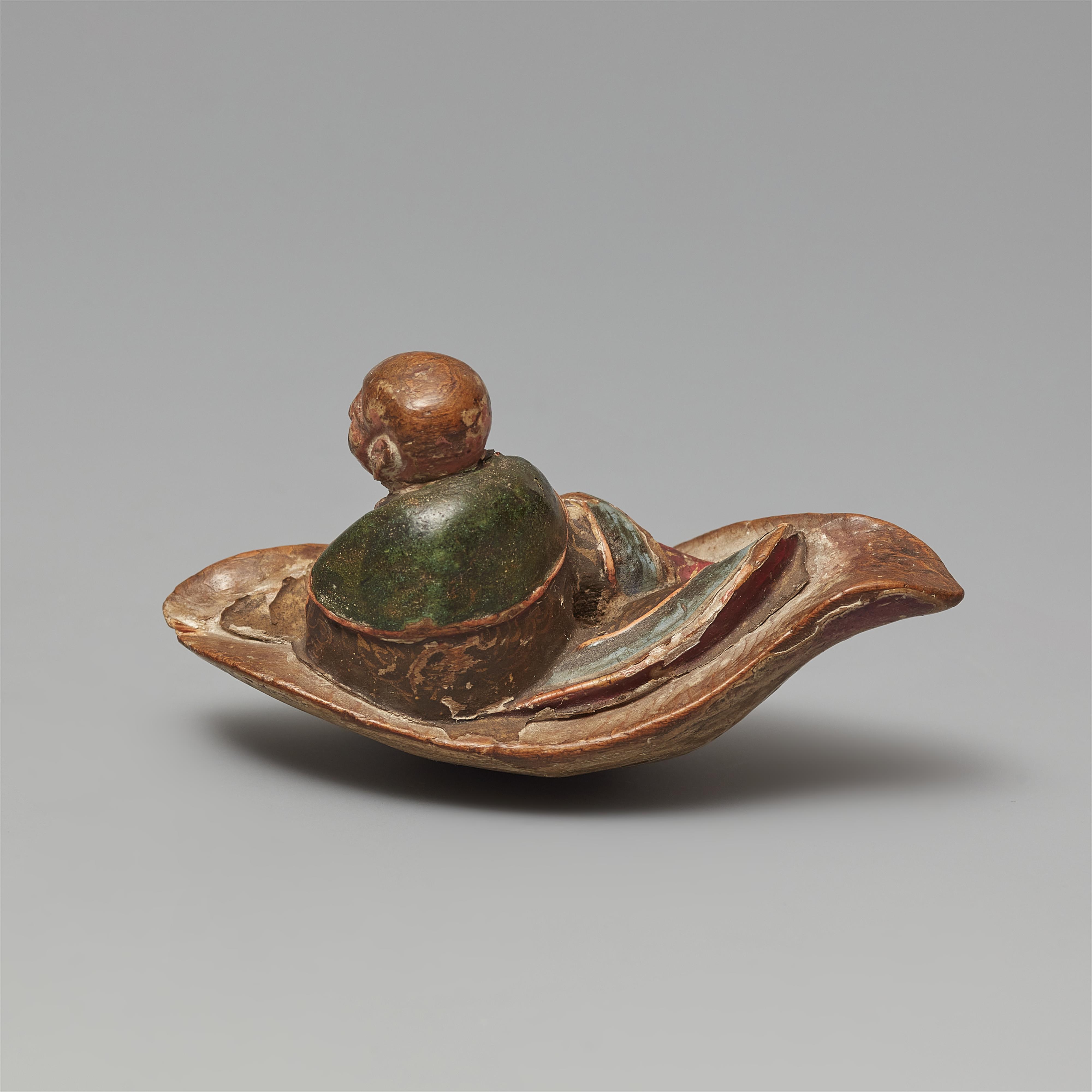 A painted softwood netsuke of a monk on a leaf. 18/19th century - image-3