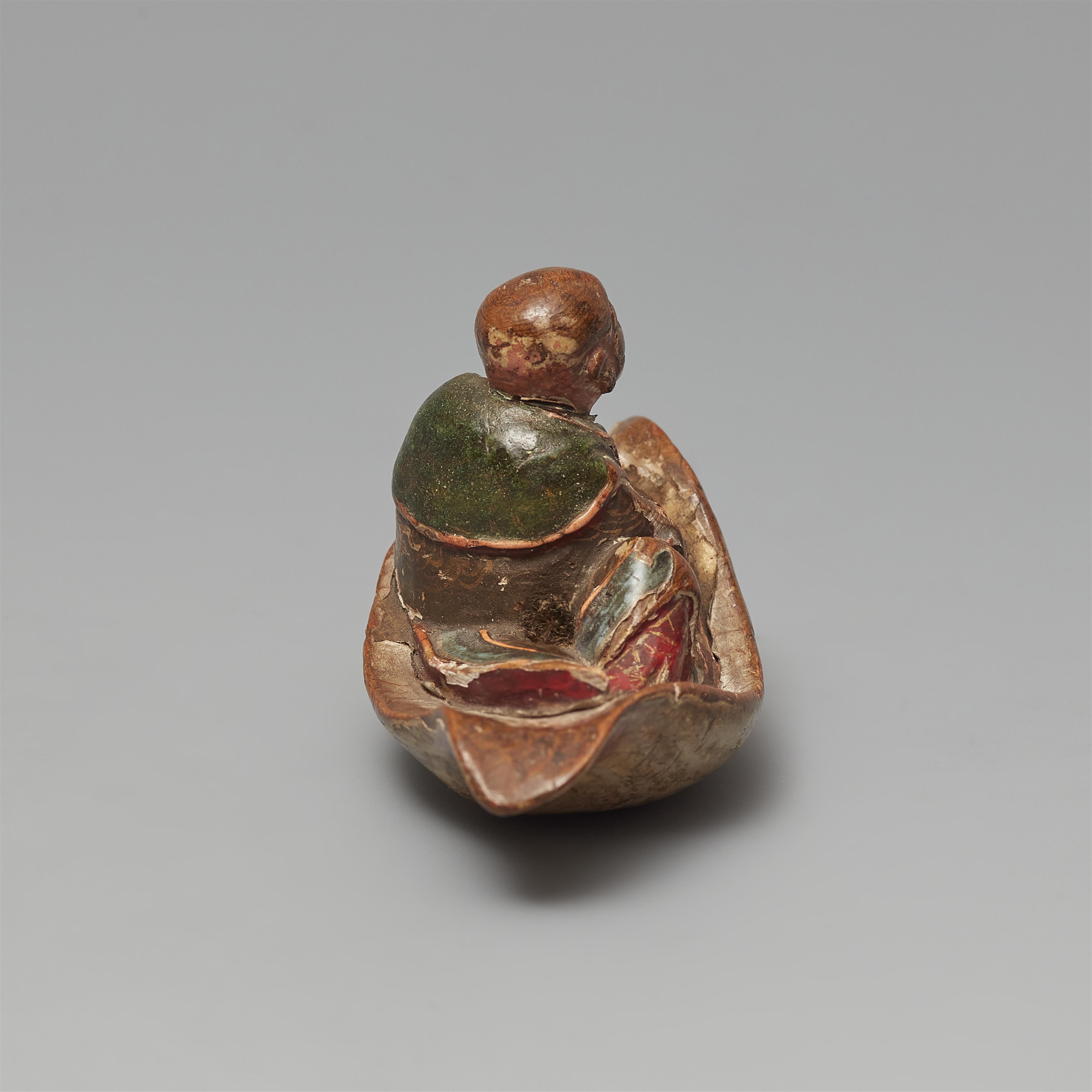 A painted softwood netsuke of a monk on a leaf. 18/19th century - image-4