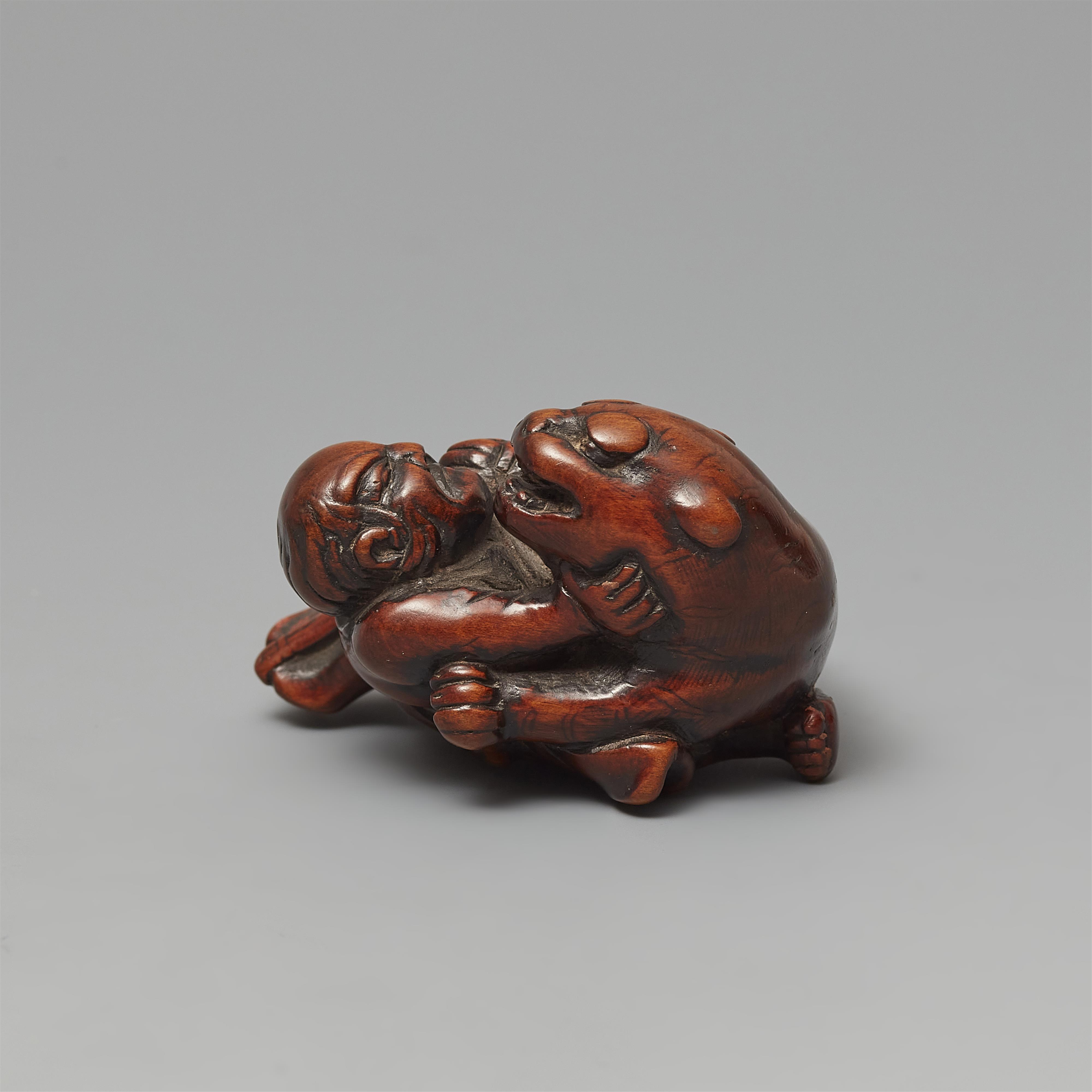 Netsuke des Busho einen Tiger bezwingend. Buchsbaum. 18./frühes 19. Jh. - image-3