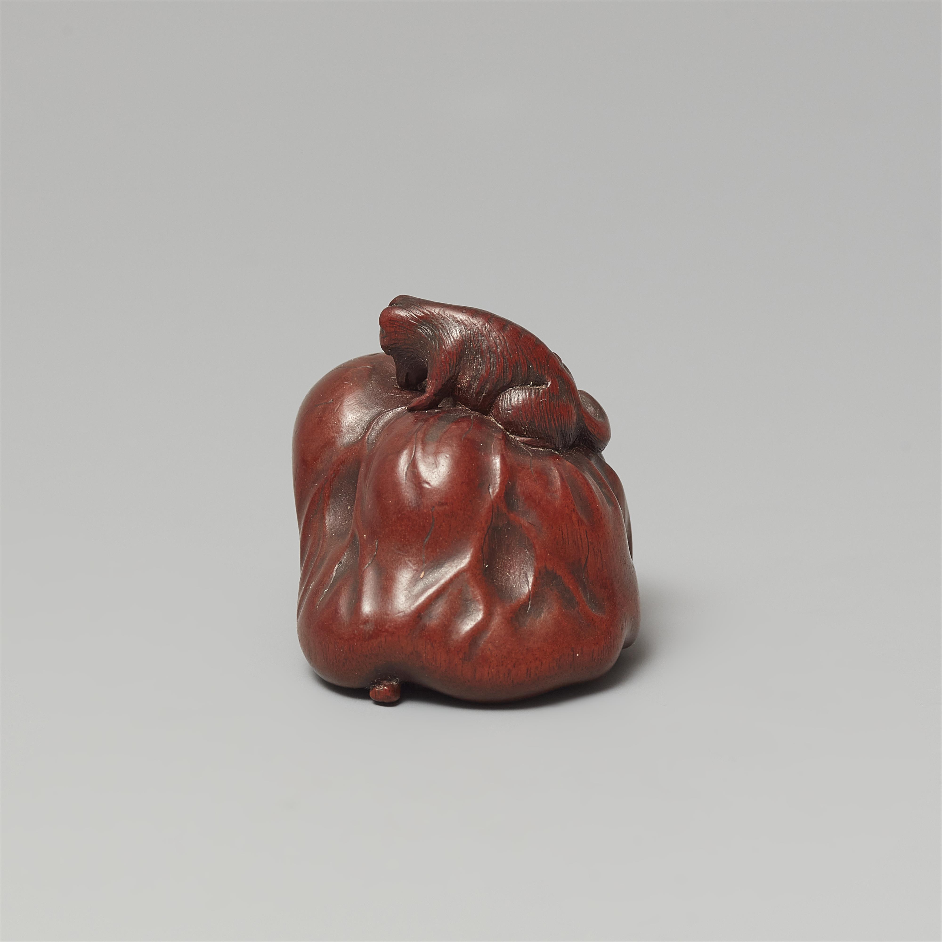 A Ise-Yamada wood netsuke of a tanuki smothering a hunter by Masakazu. Second half 19th century - image-3