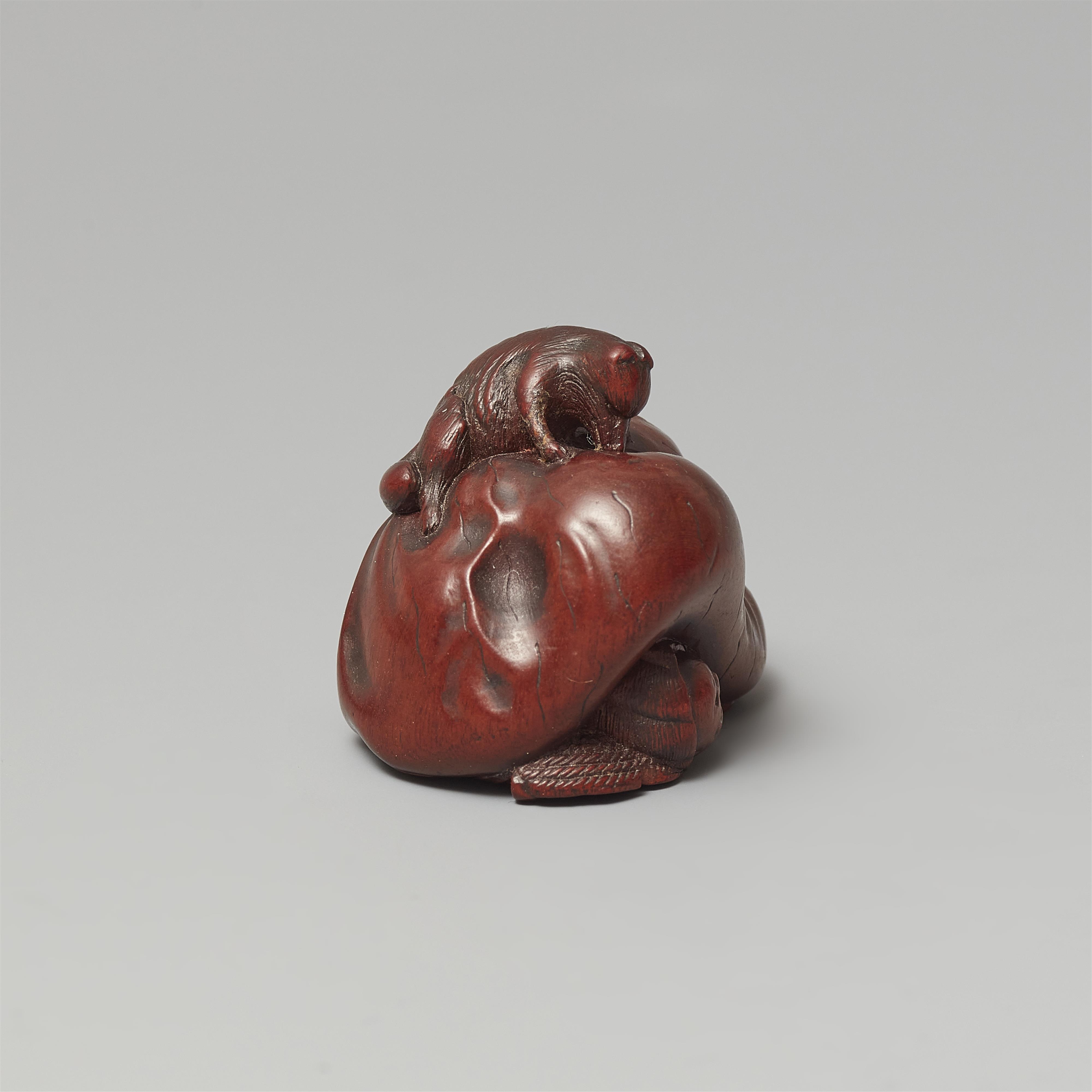 A Ise-Yamada wood netsuke of a tanuki smothering a hunter by Masakazu. Second half 19th century - image-5