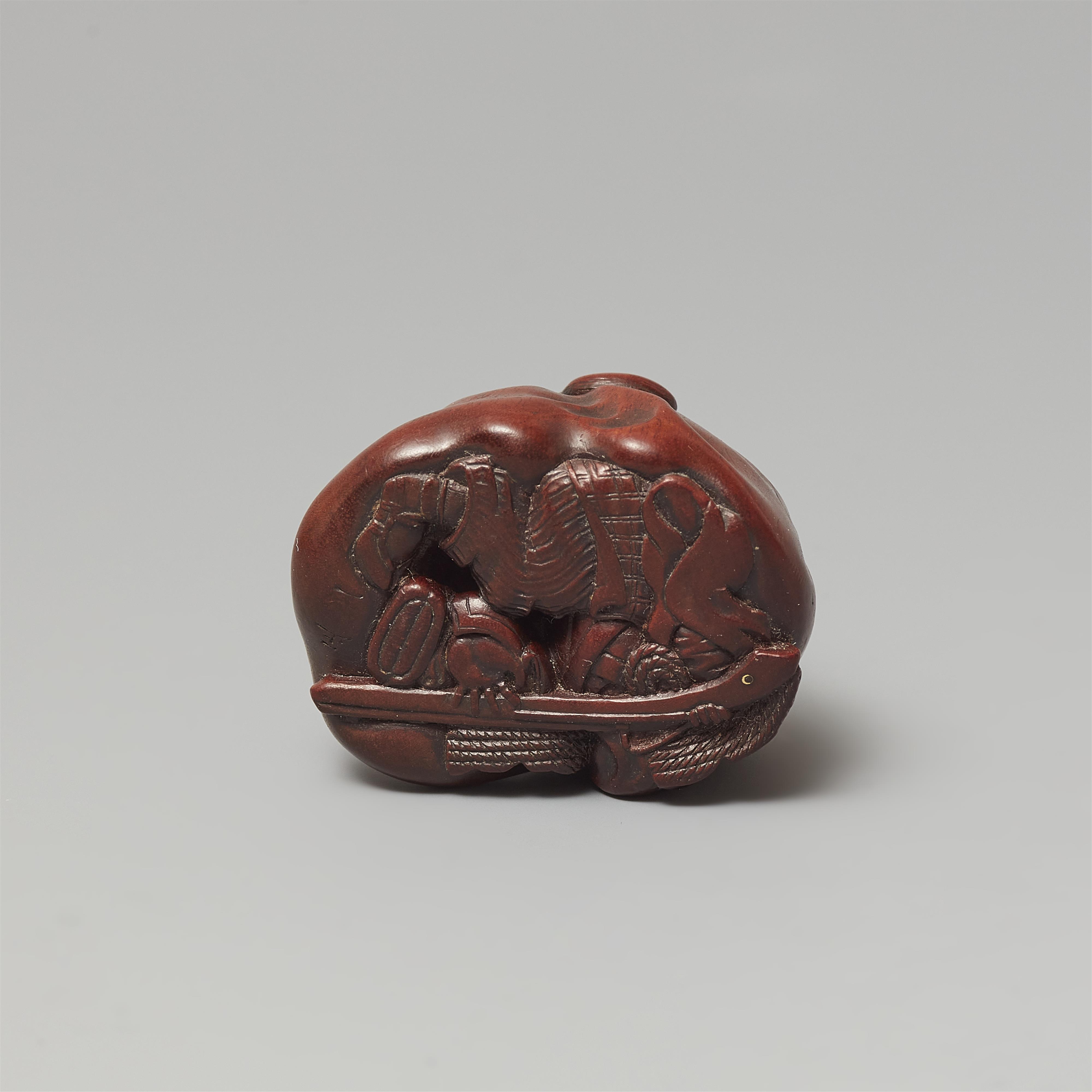 A Ise-Yamada wood netsuke of a tanuki smothering a hunter by Masakazu. Second half 19th century - image-6