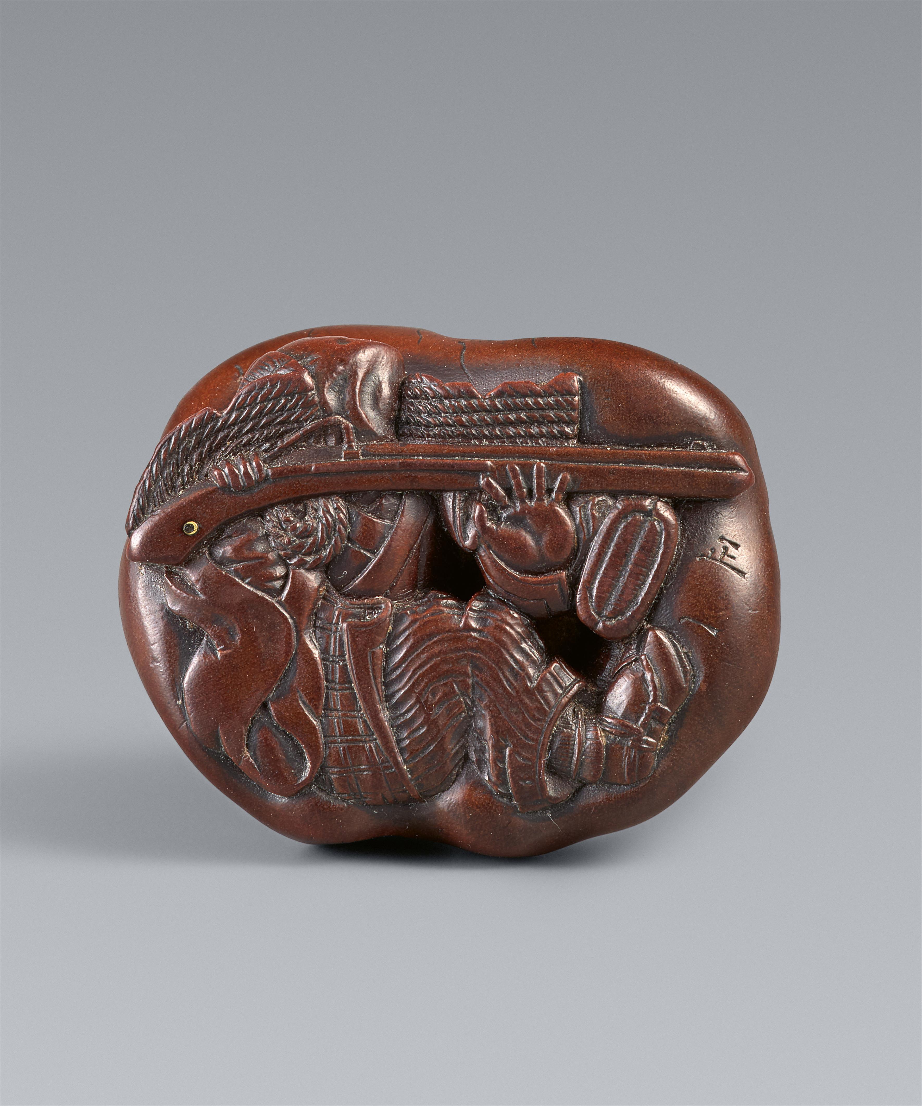 A Ise-Yamada wood netsuke of a tanuki smothering a hunter by Masakazu. Second half 19th century - image-8