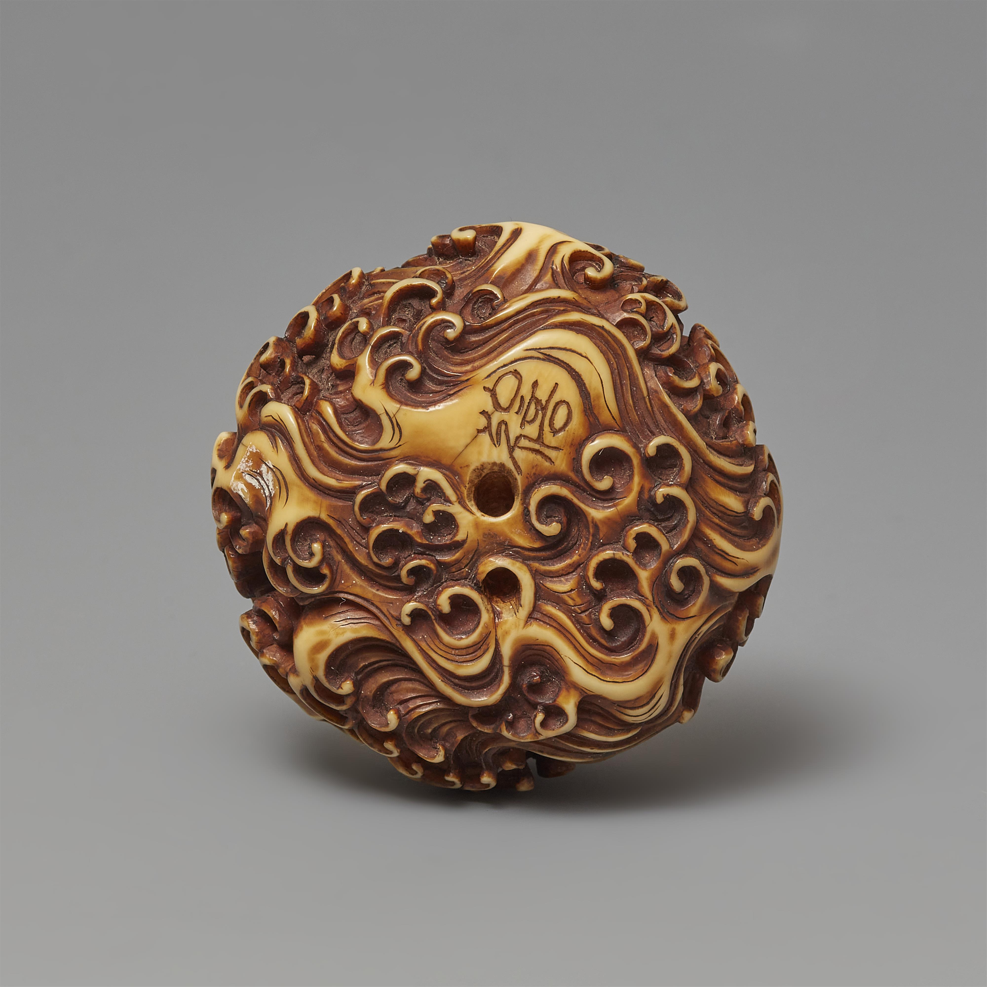 An ivory manju netsuke of a dragon amidst waves by Hironobu. Second half 19th century - image-2