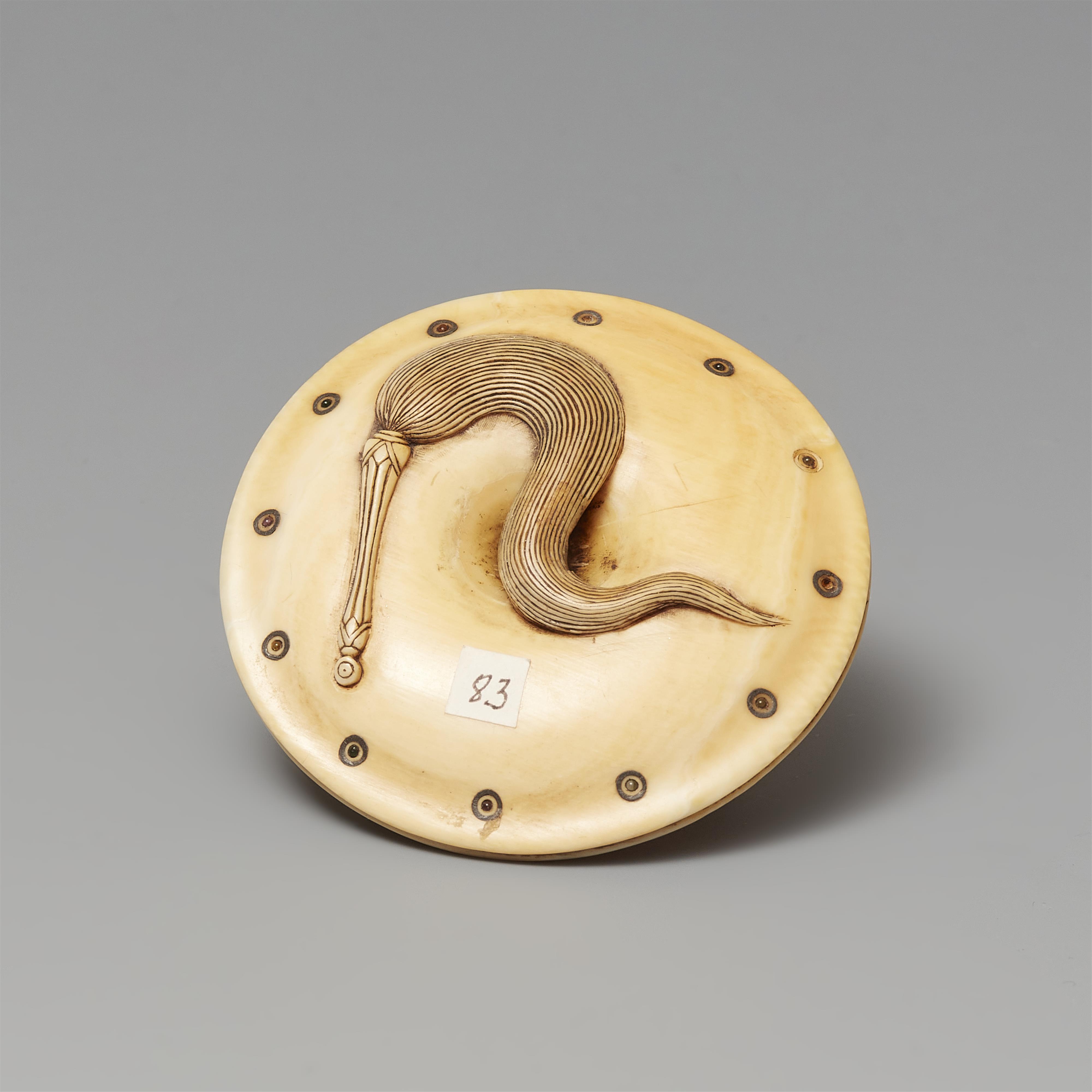 An ivory netsuke of a caparisoned shishi on a cushion. Mid-19th century - image-5