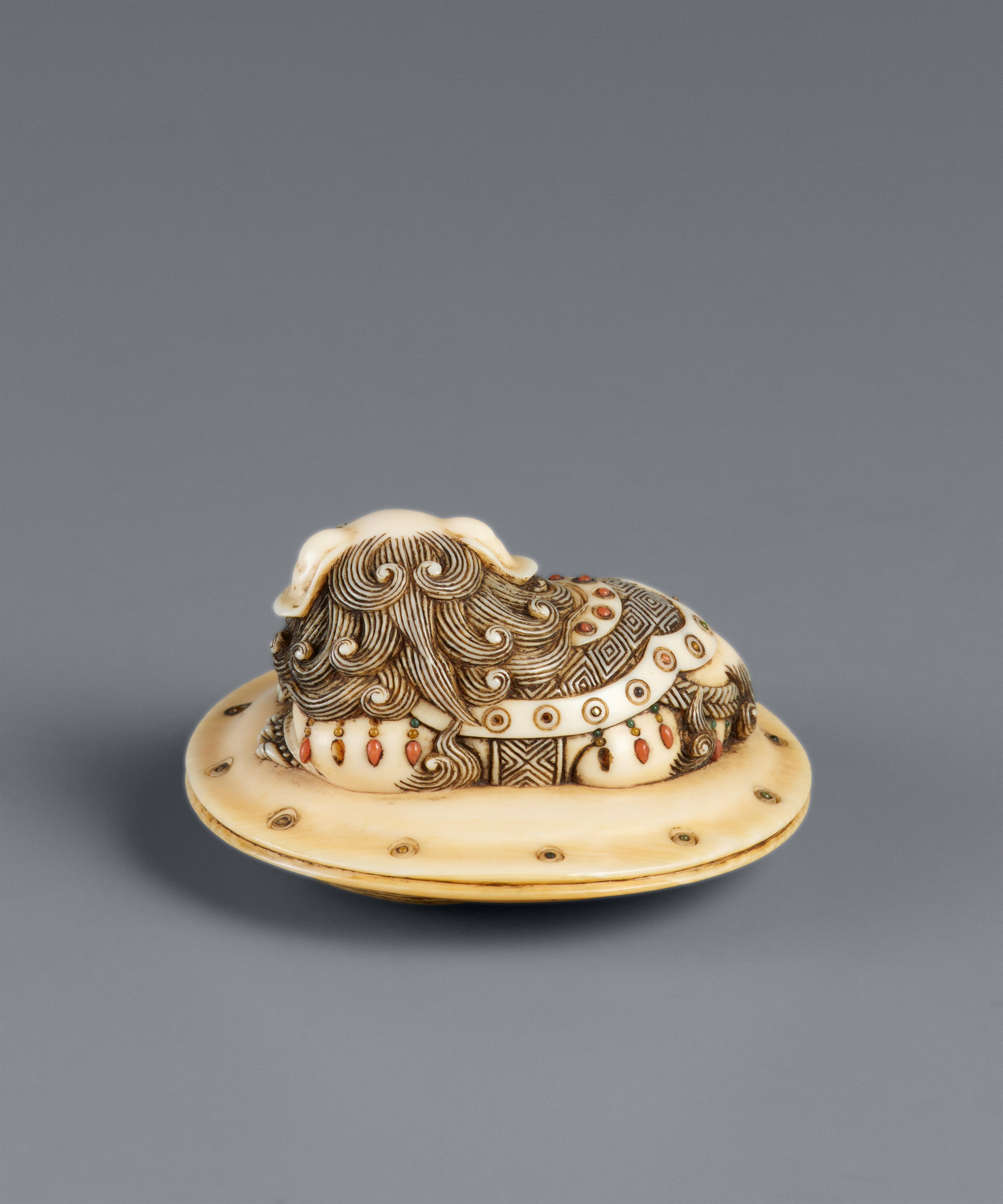 An ivory netsuke of a caparisoned shishi on a cushion. Mid-19th century - image-6