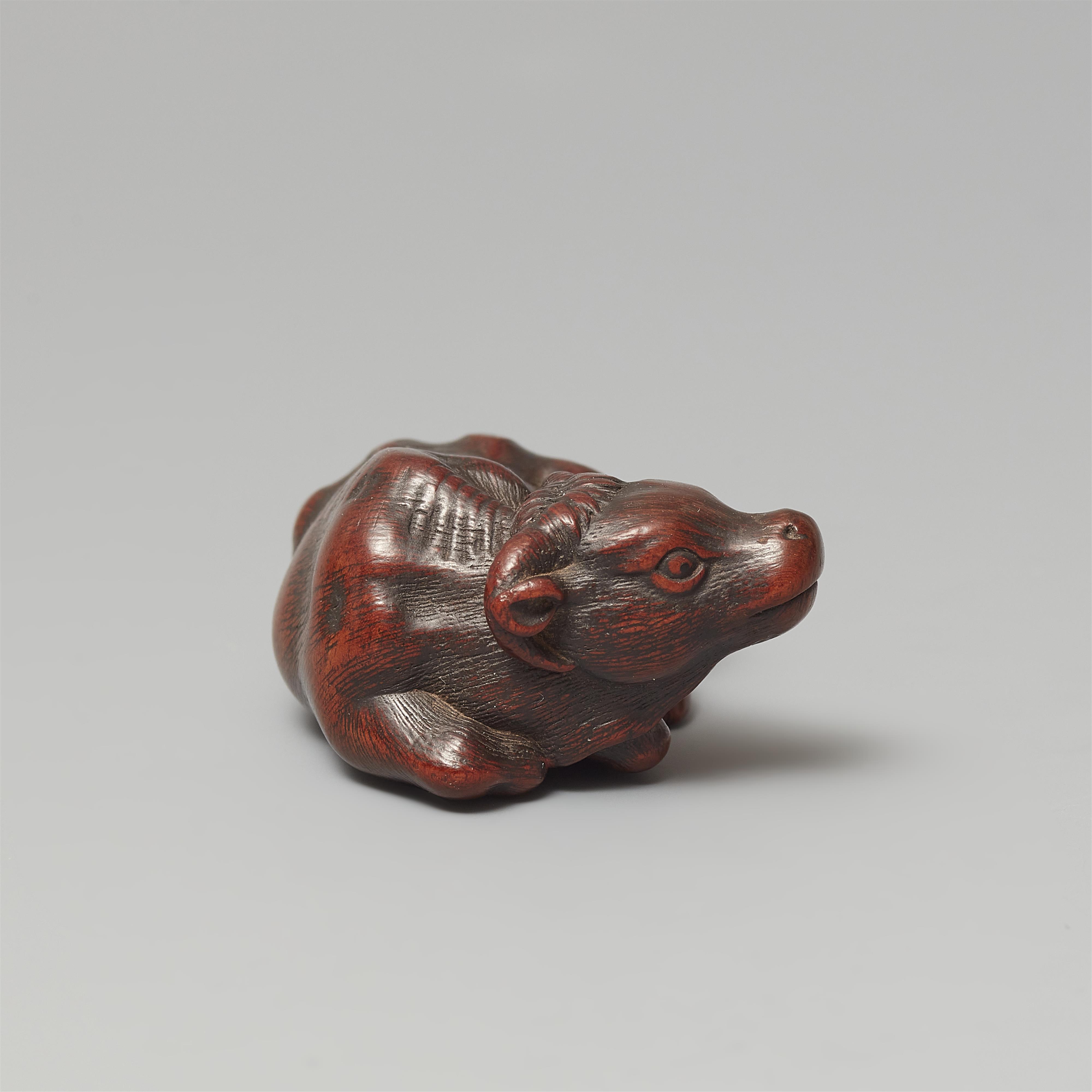 An Ise small wood netsuke of an ox by Masanao. 19th century - image-2