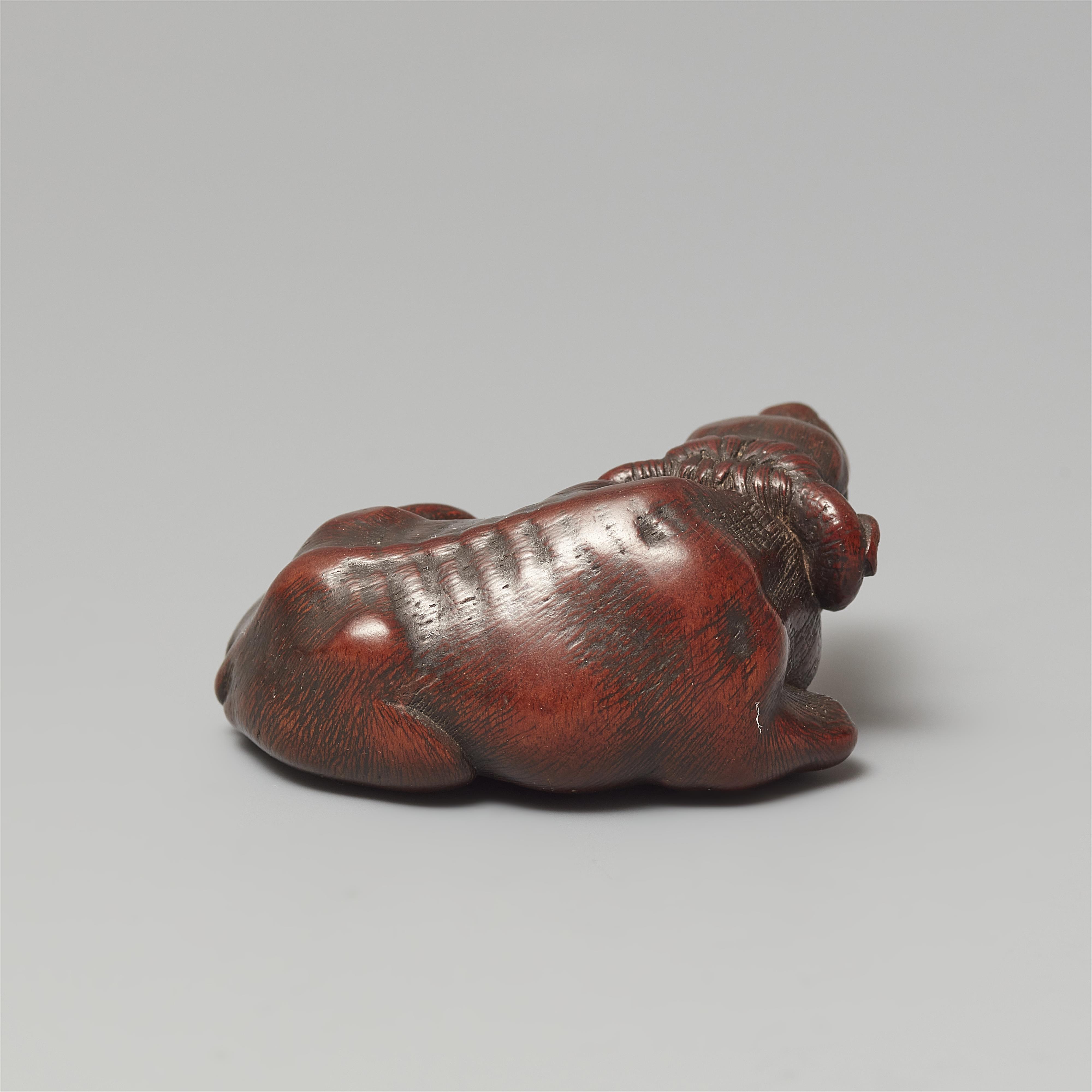 An Ise small wood netsuke of an ox by Masanao. 19th century - image-3