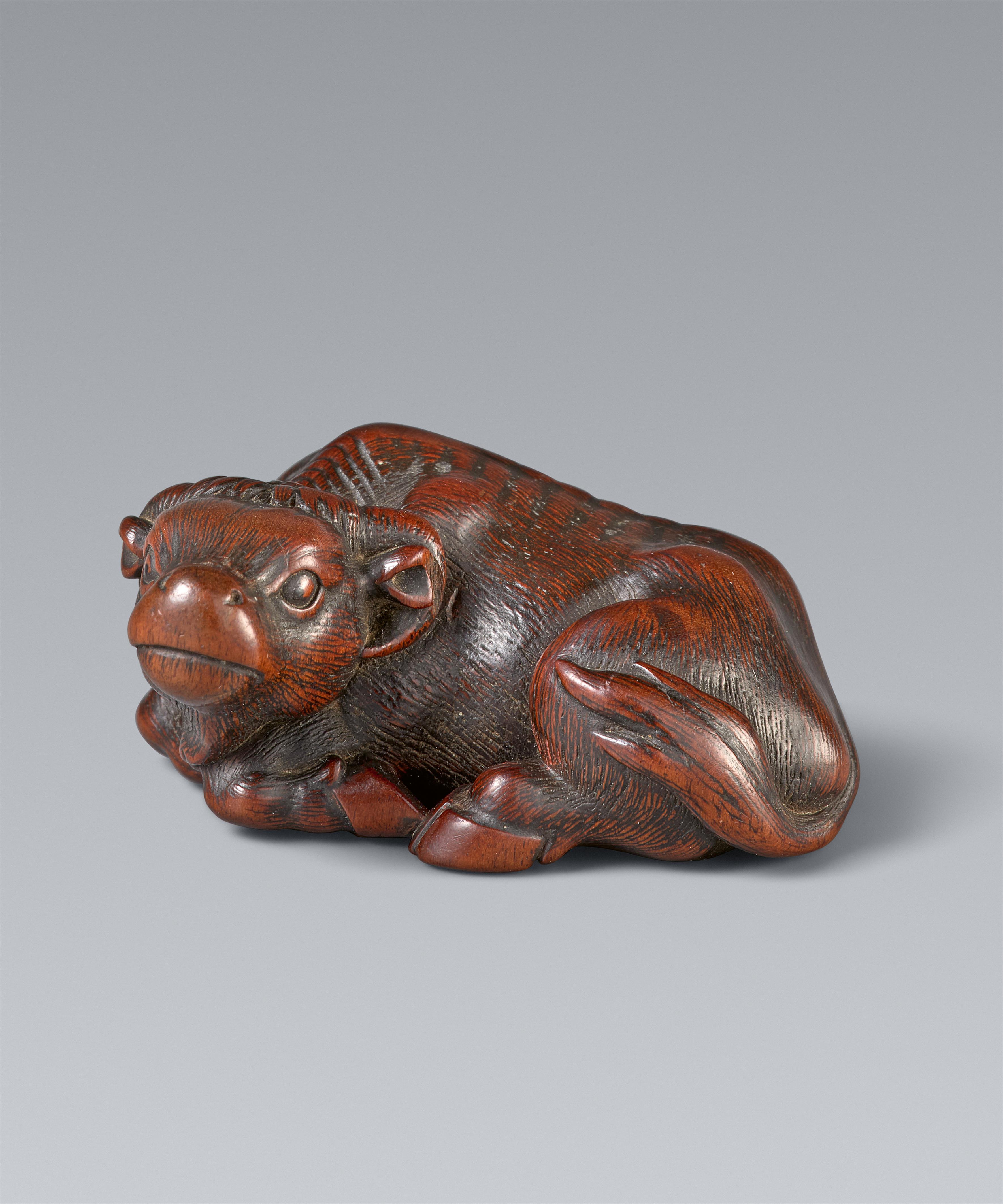 An Ise small wood netsuke of an ox by Masanao. 19th century - image-1