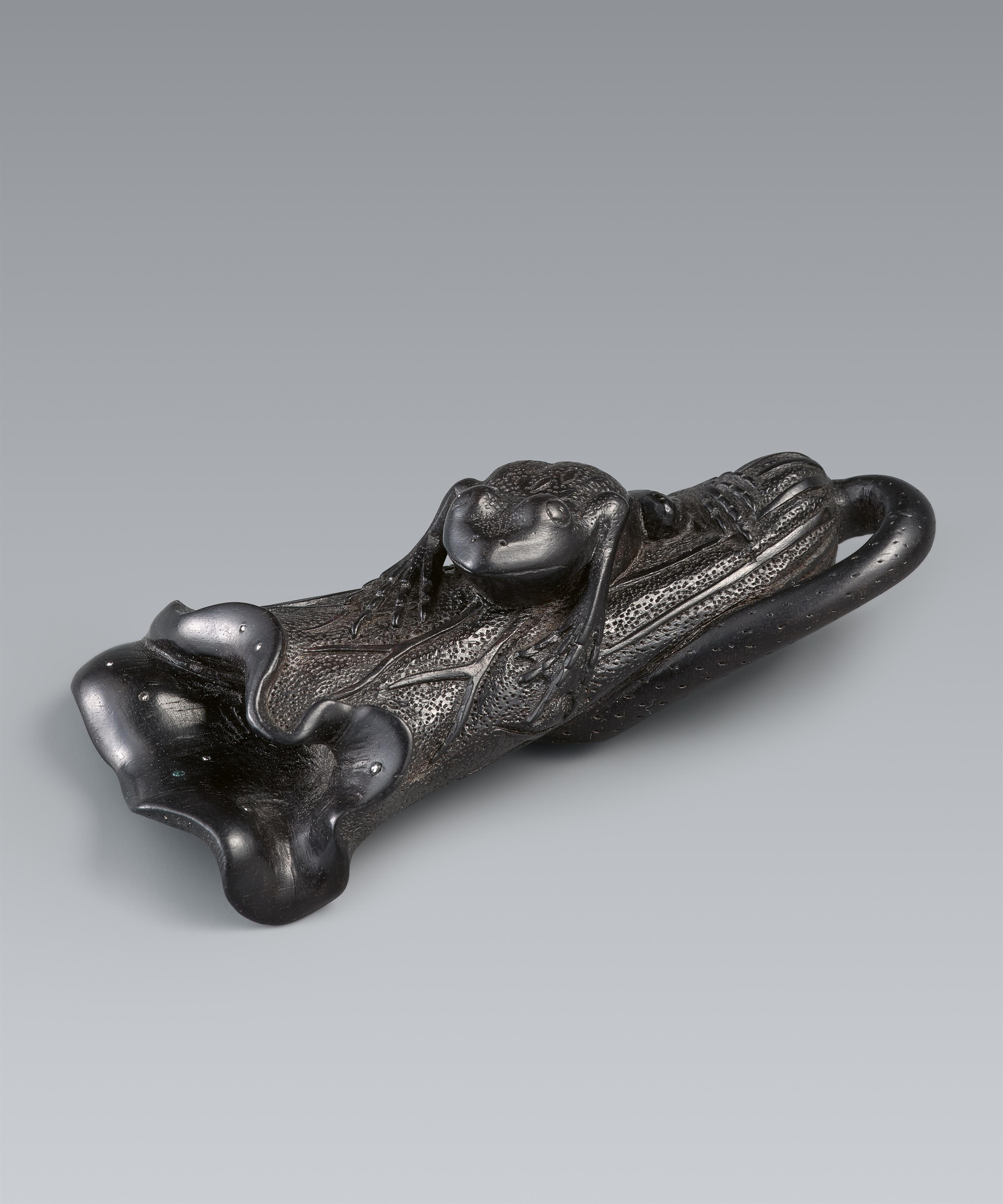 A large black wood netsuke of a frog on a folded lotus leaf. 19th century - image-1