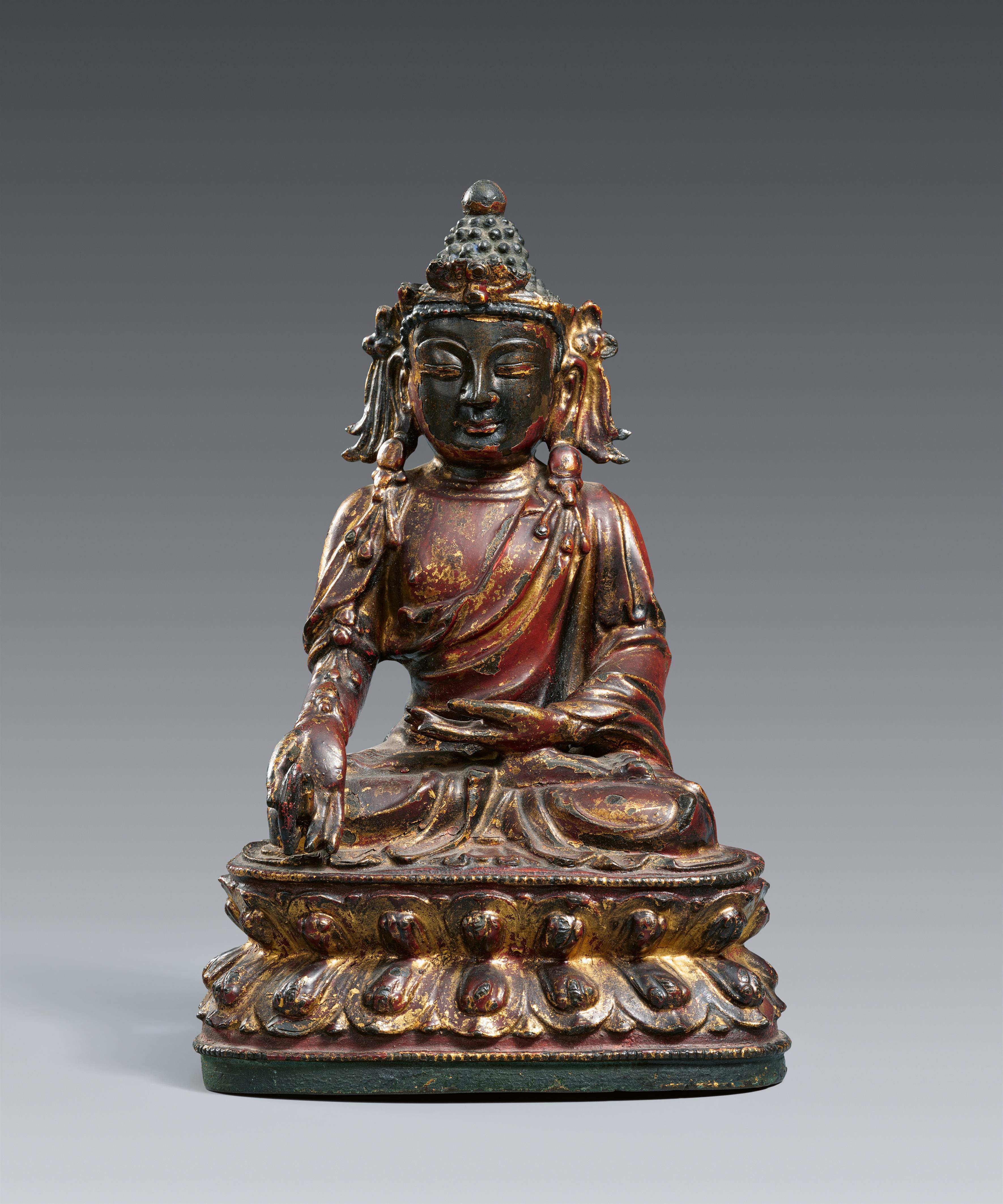 A gilt and lacquered bronze figure of Bhaisajyaguru, the Medicine Buddha. In the style of the late Ming dynasty - image-1