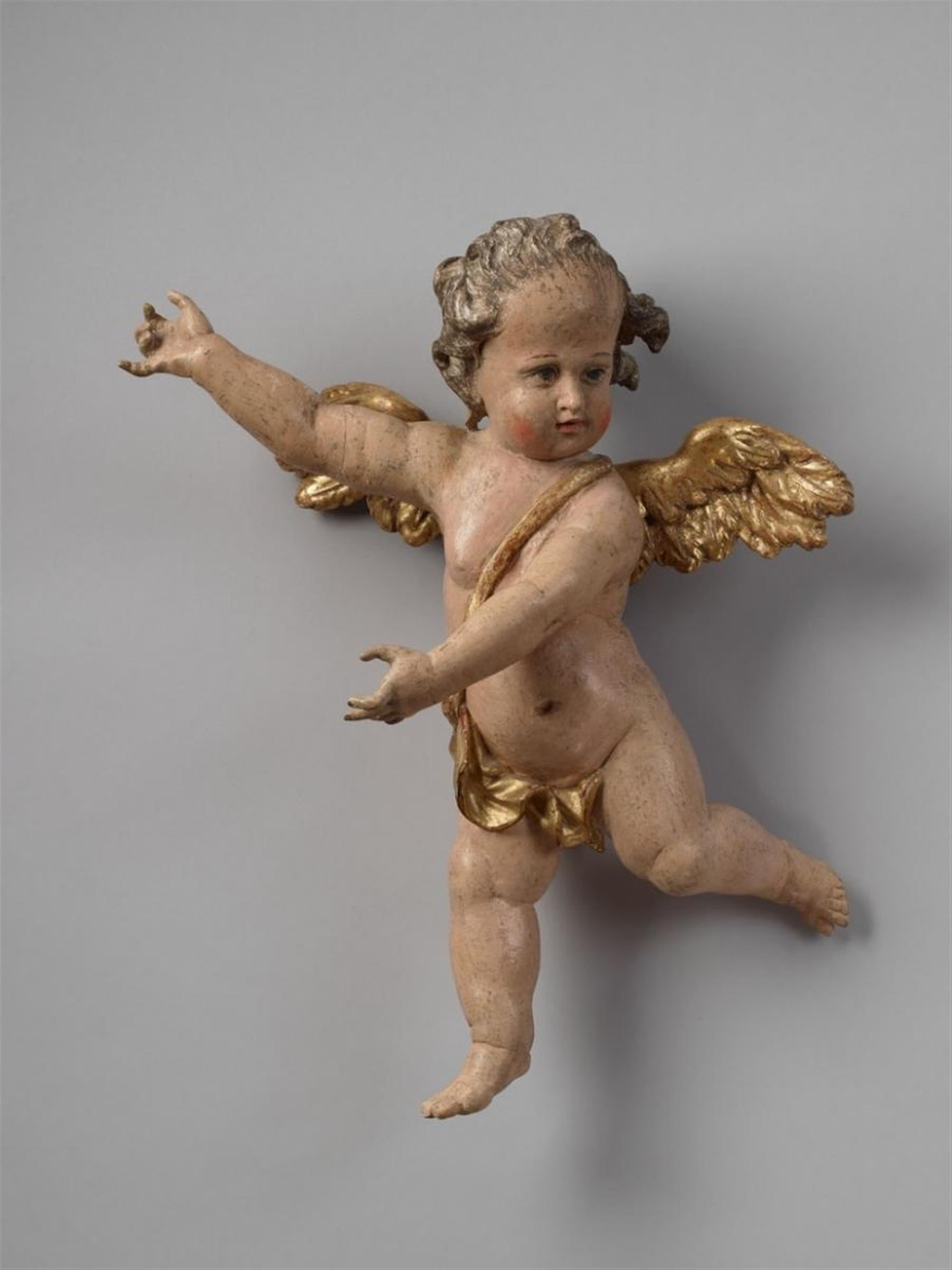 A wood figure of A WINGED CUPID - image-1