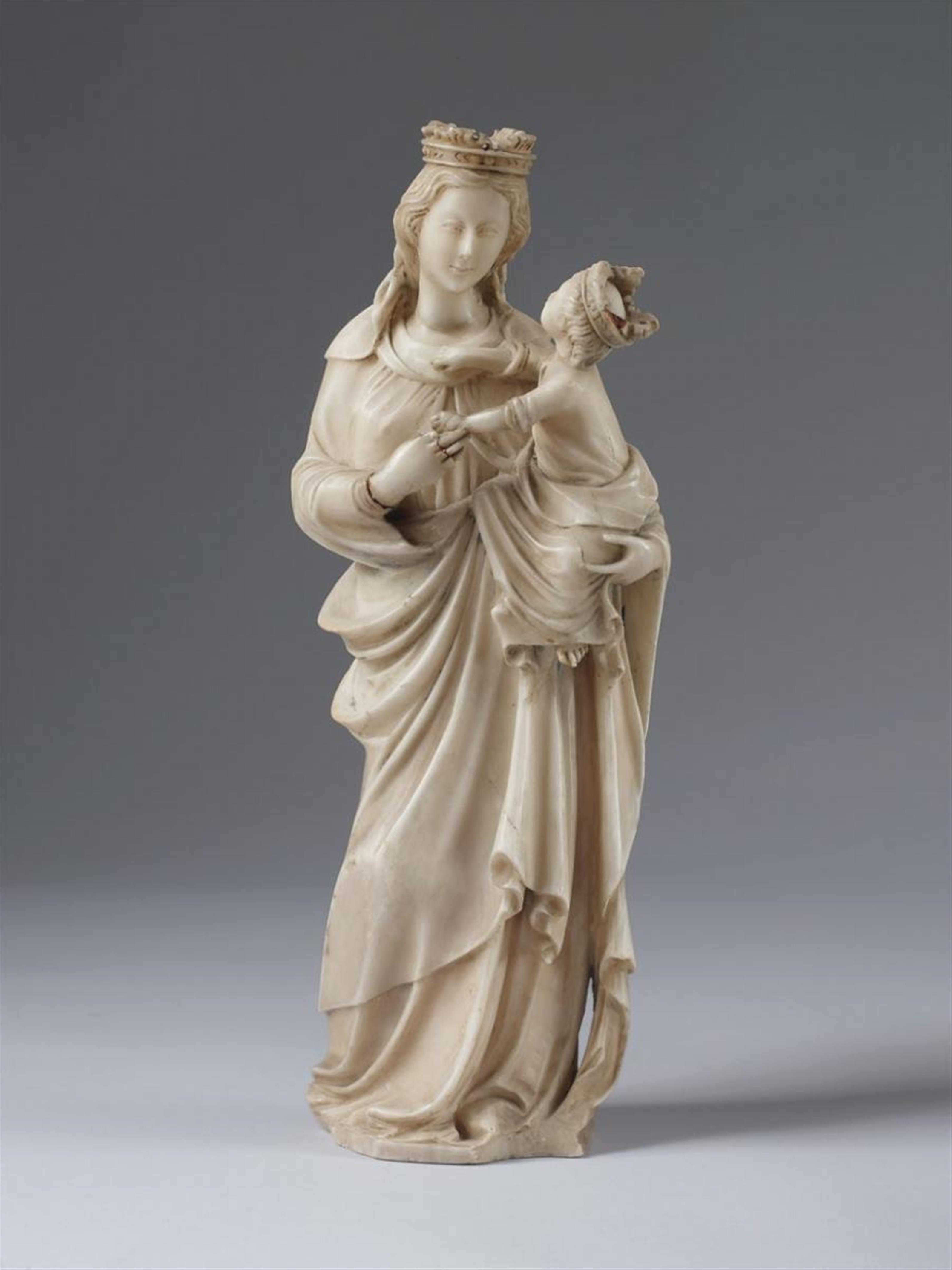 An alabaster figure of THE VIRGIN WITH CHILD - image-1