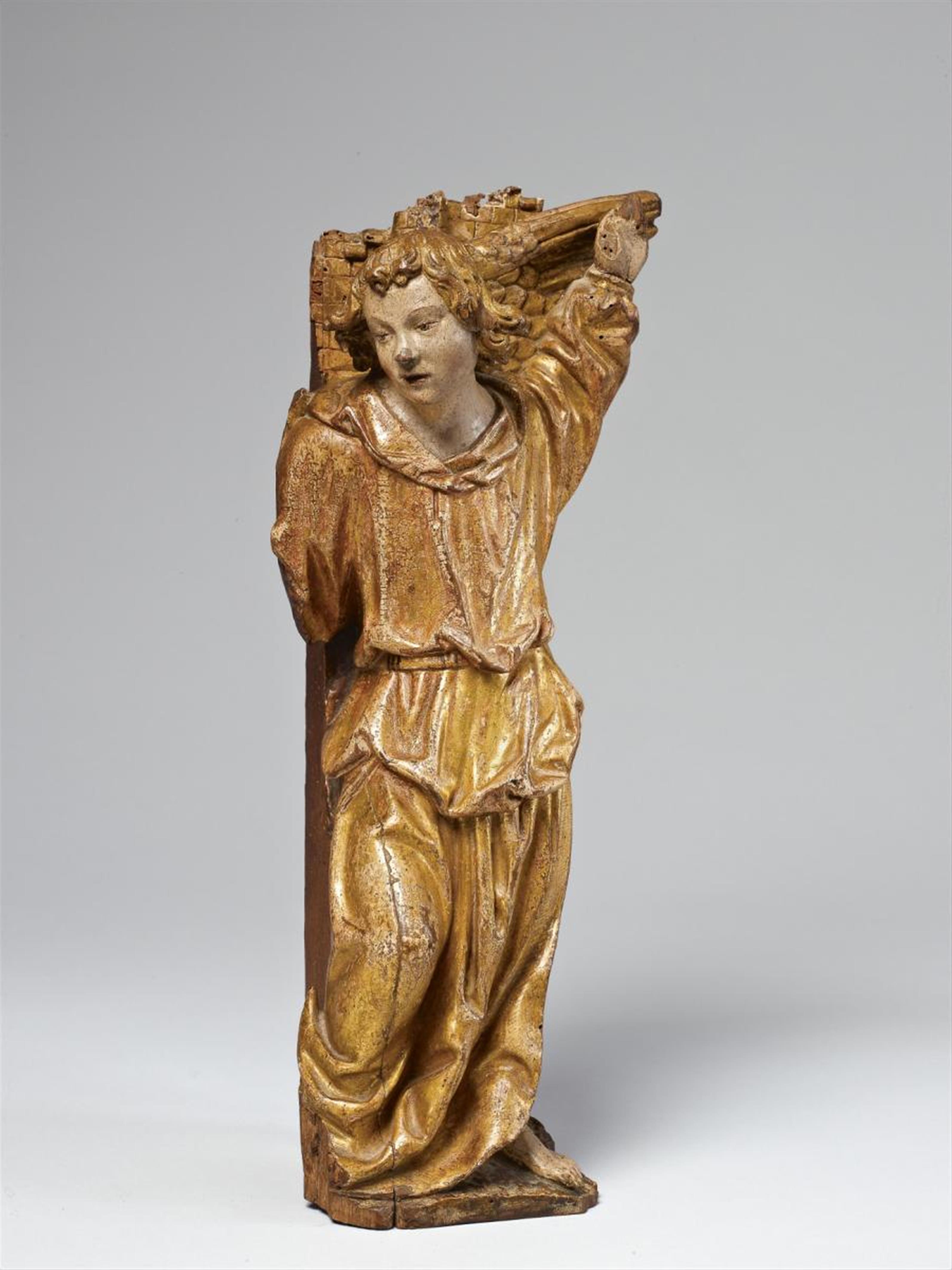 A wood high-relief figure of AN ANGEL FROM AN ANNUNCIATION - image-1