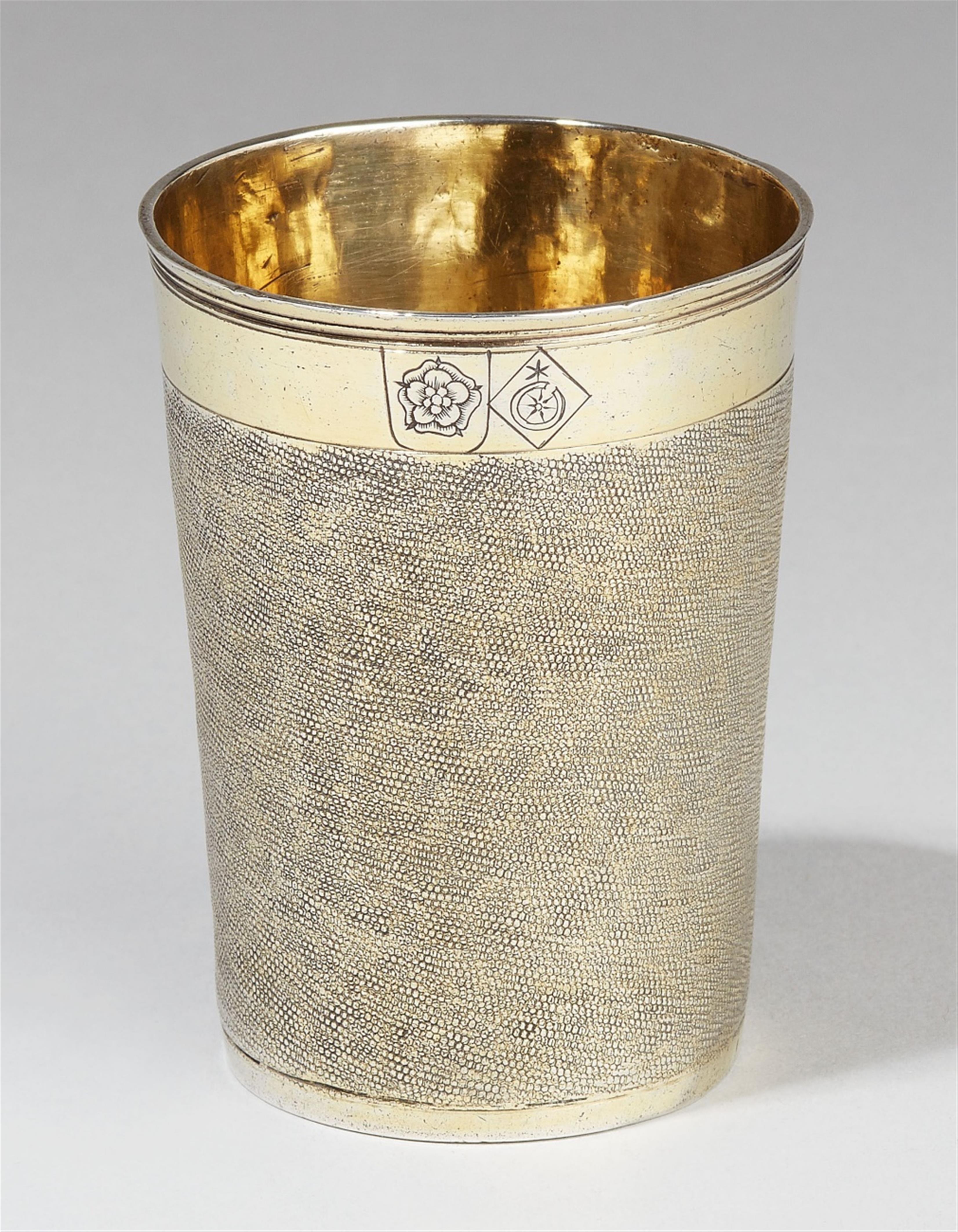 A Nuremberg partially gilt silver snakeskin beaker. Engraved with a ...