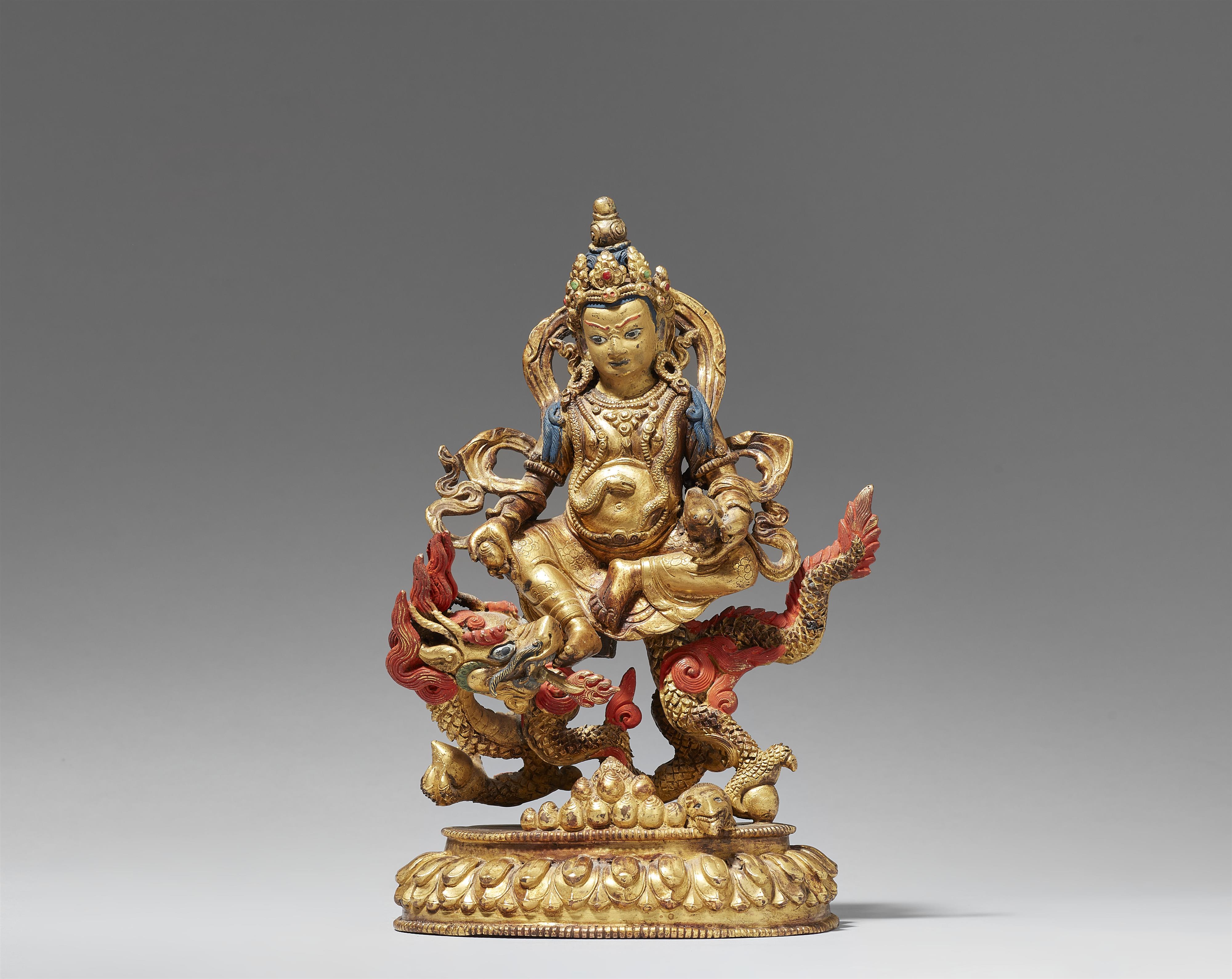 A Tibetochinese gilt bronze figure of Jambhala. Late 19th century - Lot 104