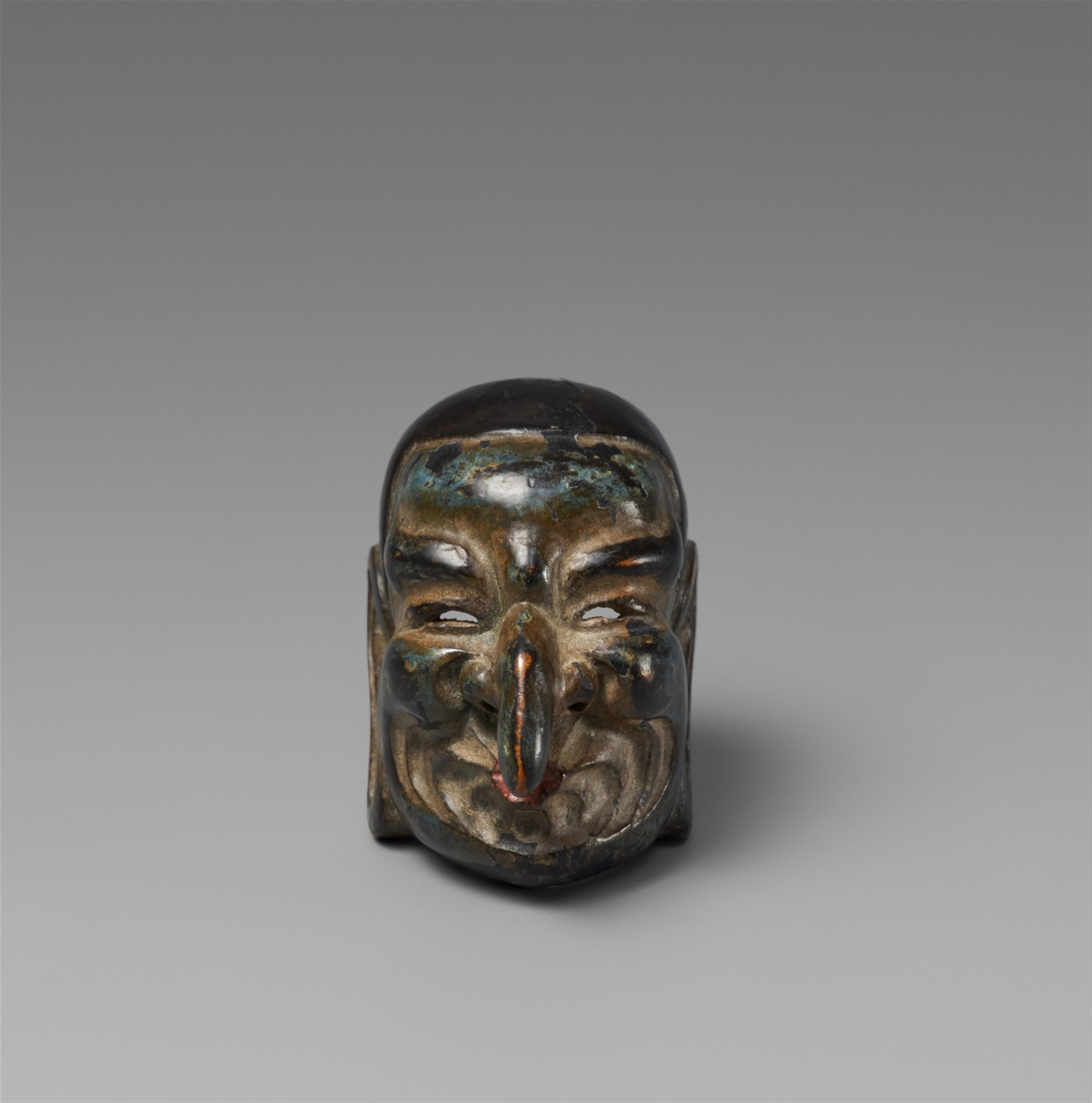 A Wood And Lacquer Netsuke Of A Gigaku Mask Late 19th Early 20th Century Lot 388