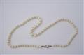 An Art Déco platinum, yellow gold and pearl necklace. - image-2