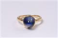 An 18k gold ring with a sapphire cabochon. - image-2